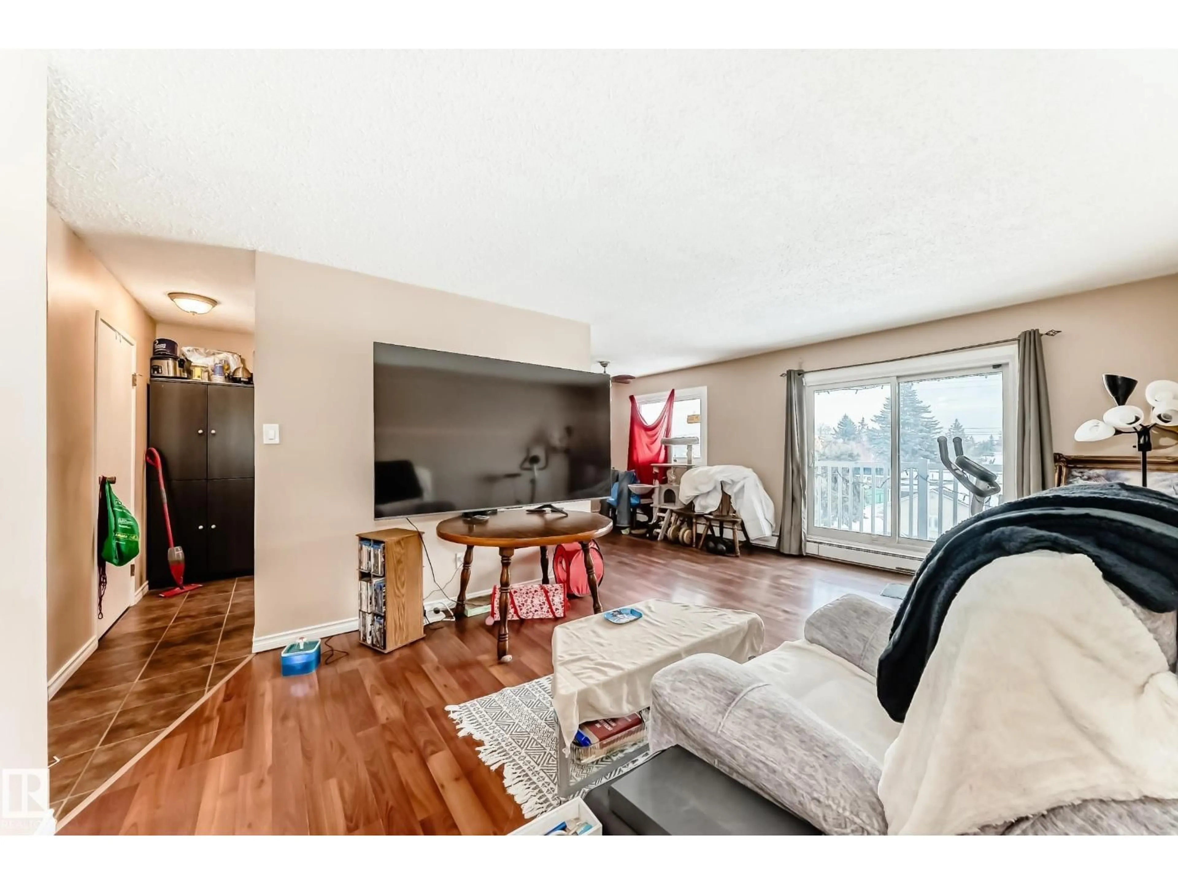 Living room with furniture, wood/laminate floor for #305 - 10615 156 ST, Edmonton Alberta T5P2S2