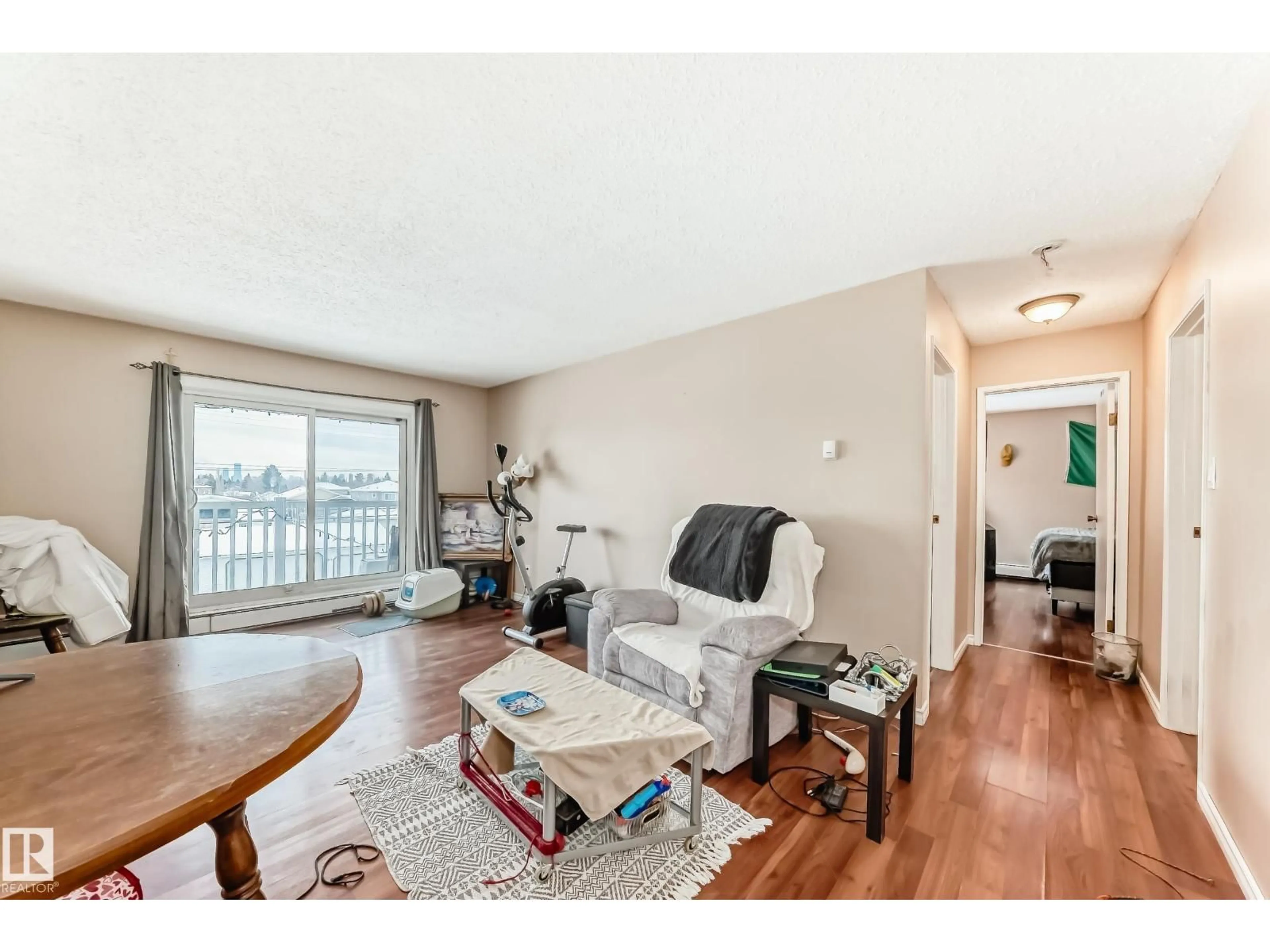 Living room with furniture, wood/laminate floor for #305 - 10615 156 ST, Edmonton Alberta T5P2S2