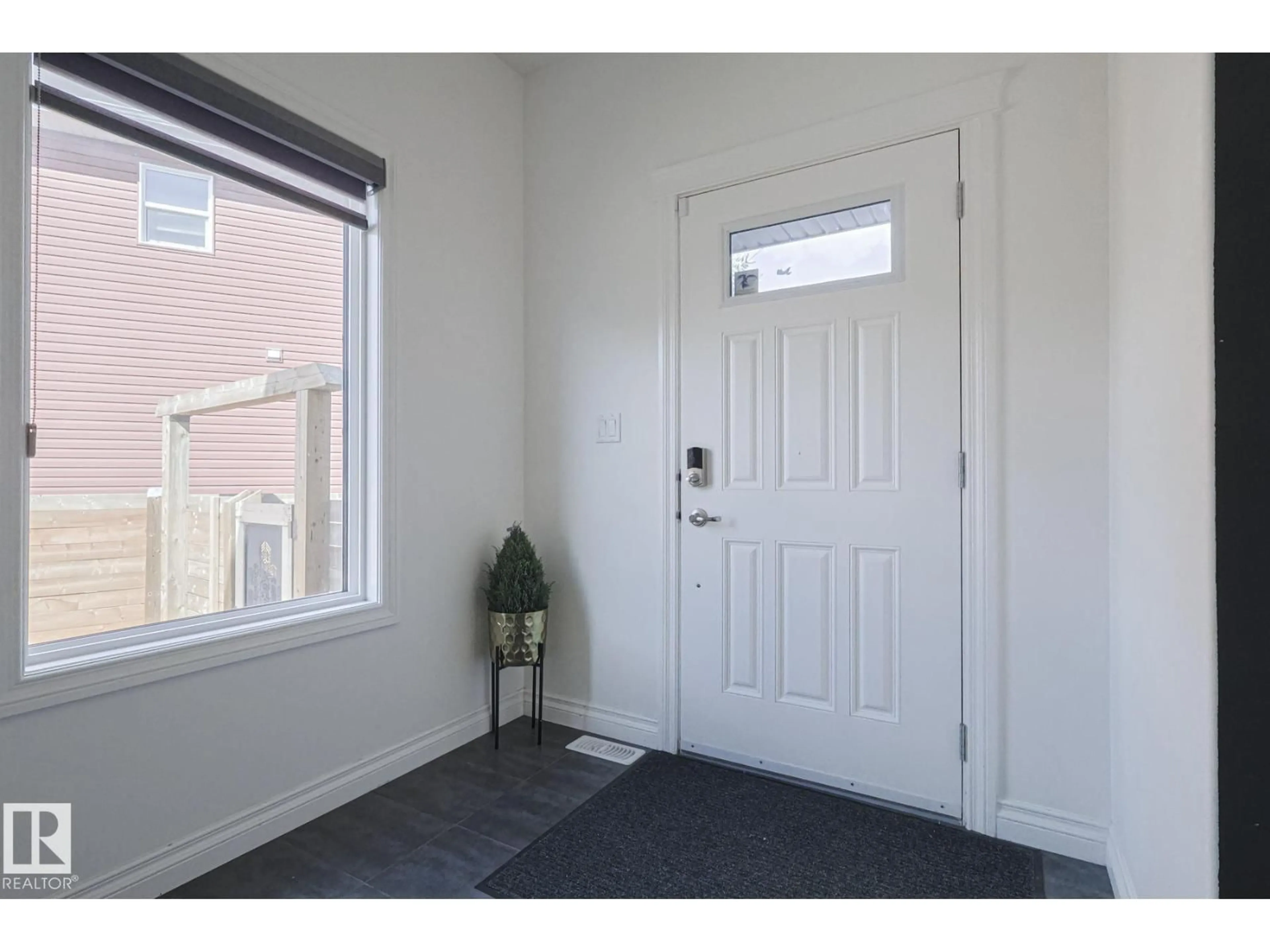 Indoor entryway for 720 CHARLESWORTH WY, Edmonton Alberta T6X2E9