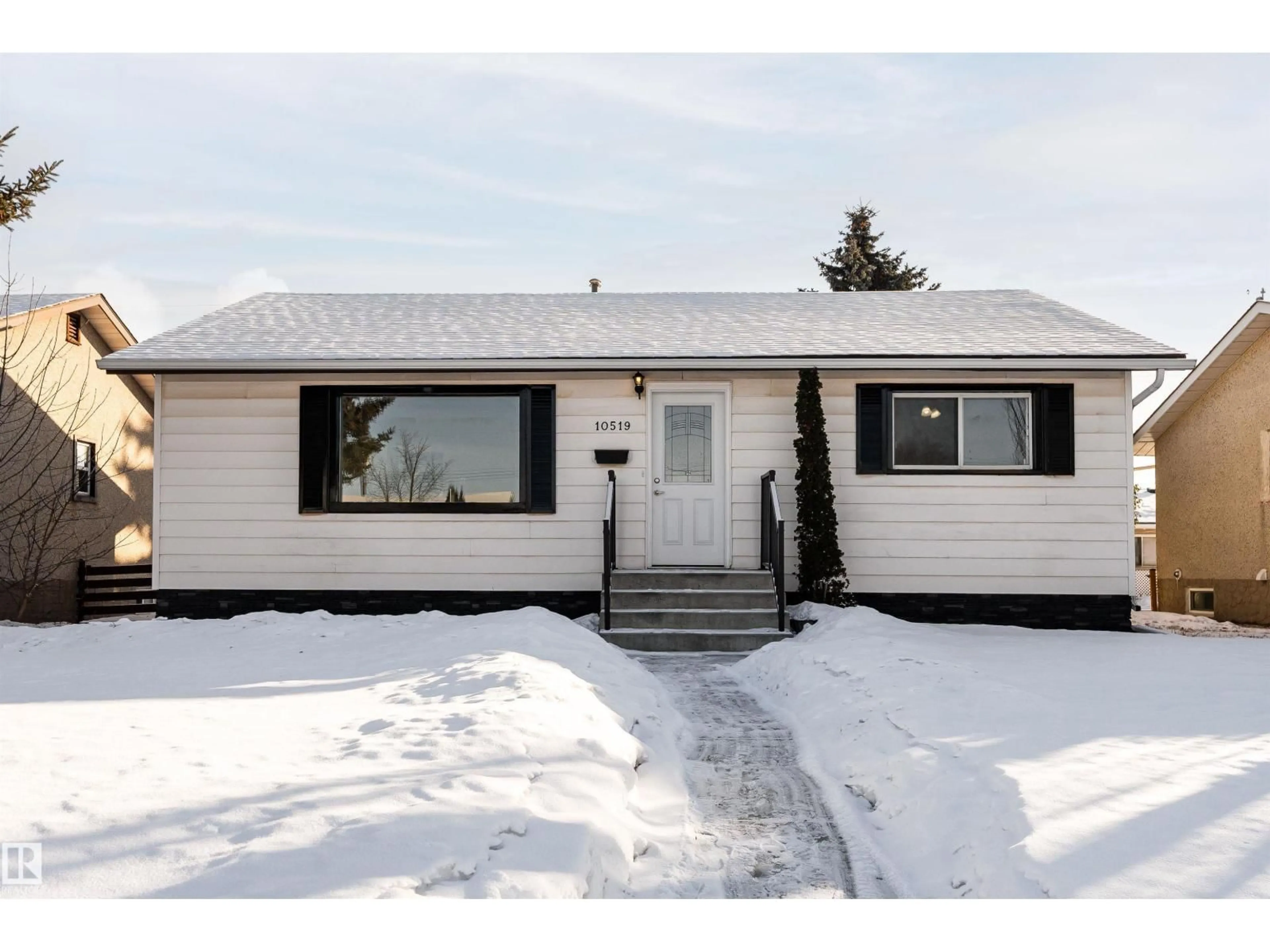 Home with vinyl exterior material, street for 10519 40 ST, Edmonton Alberta T6A1S9