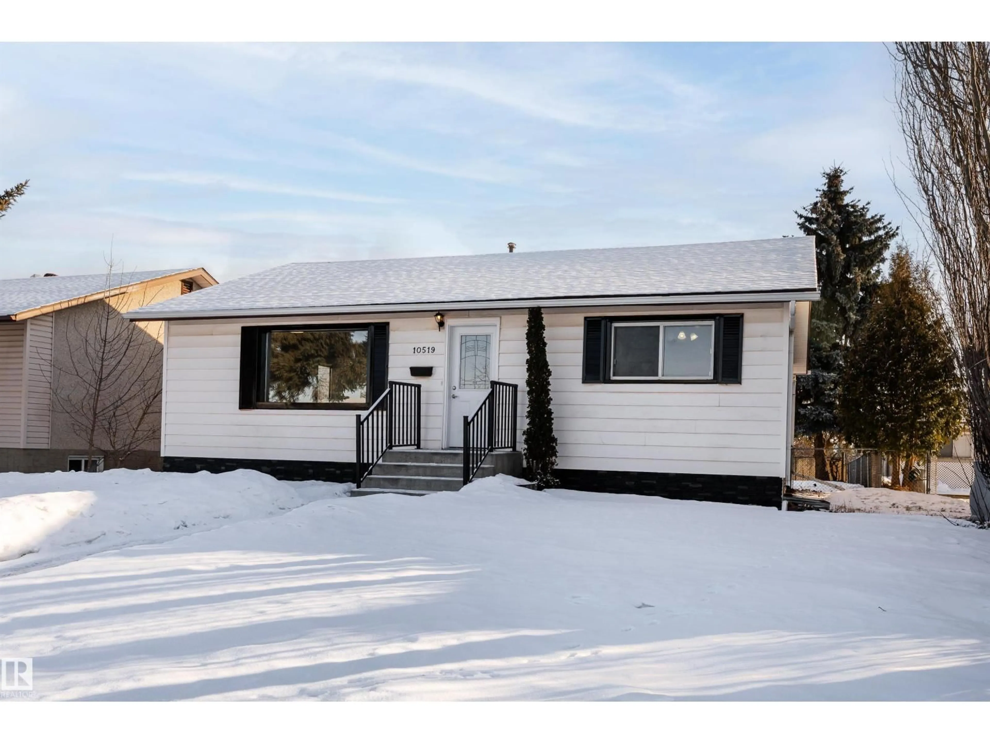 Home with vinyl exterior material, street for 10519 40 ST, Edmonton Alberta T6A1S9