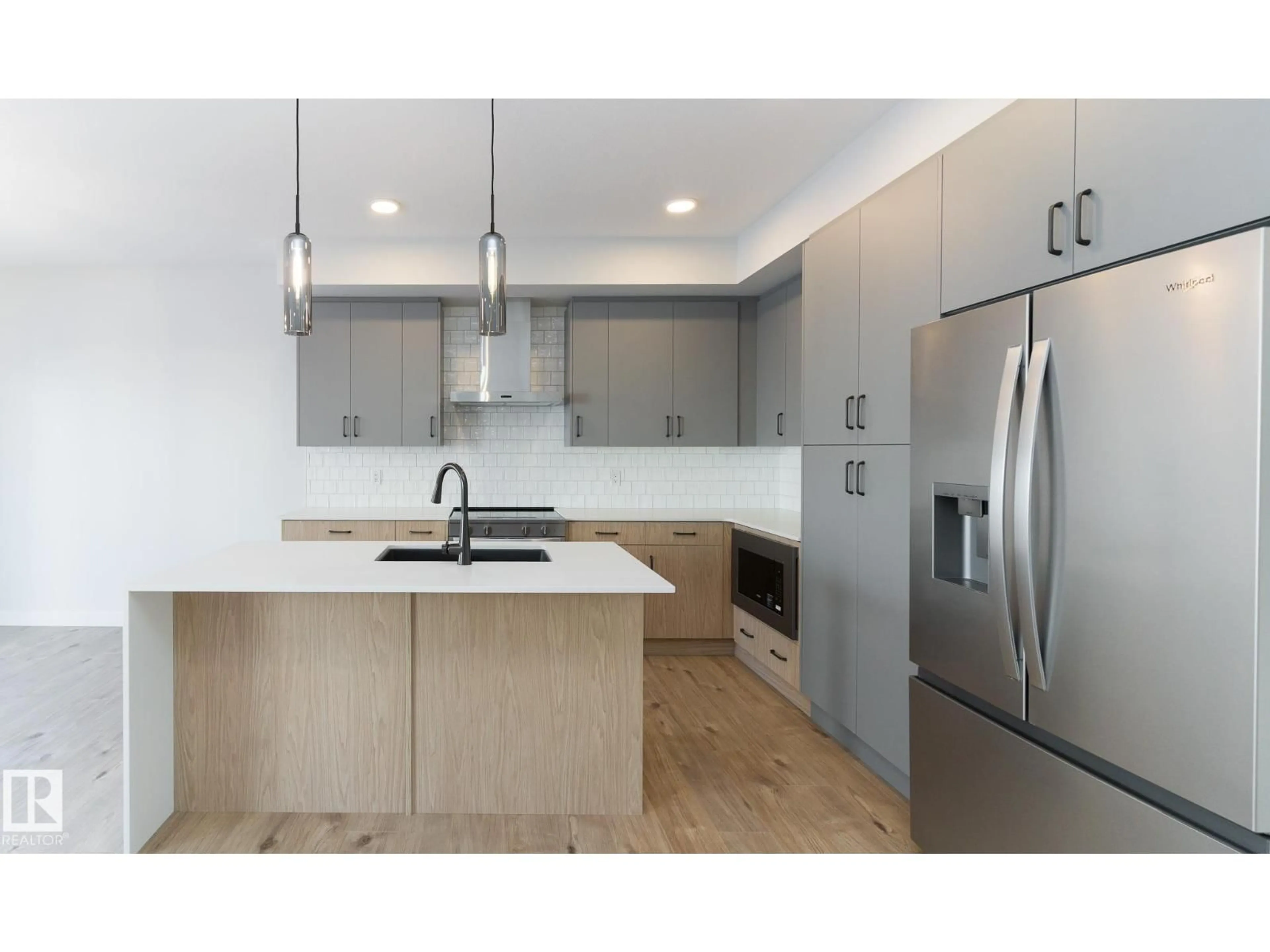 Open concept kitchen, wood/laminate floor for 3038 DIXON LD, Edmonton Alberta T6W5L2