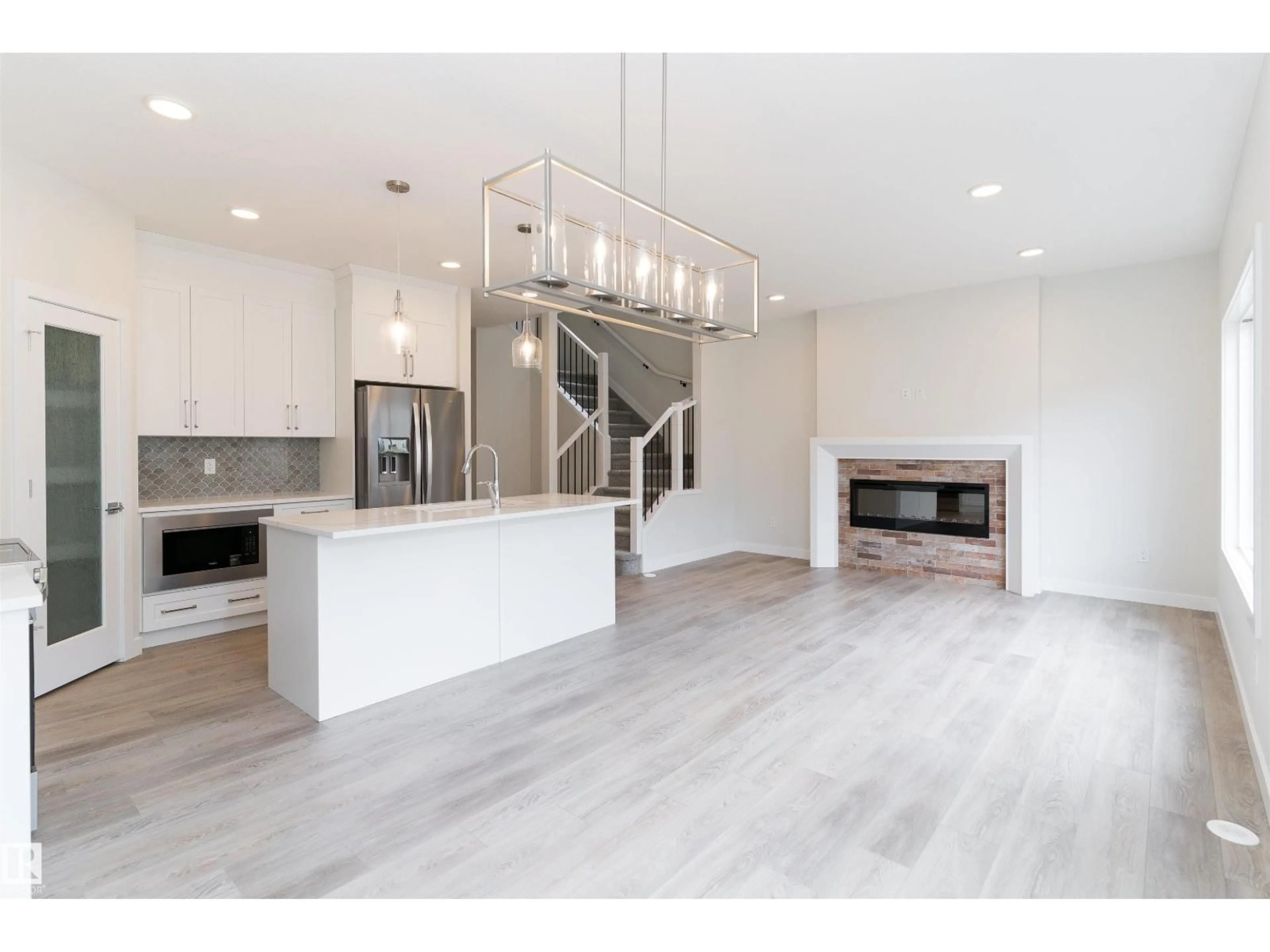 Open concept kitchen, wood/laminate floor for 3216 DIXON WY, Edmonton Alberta T6W5L3