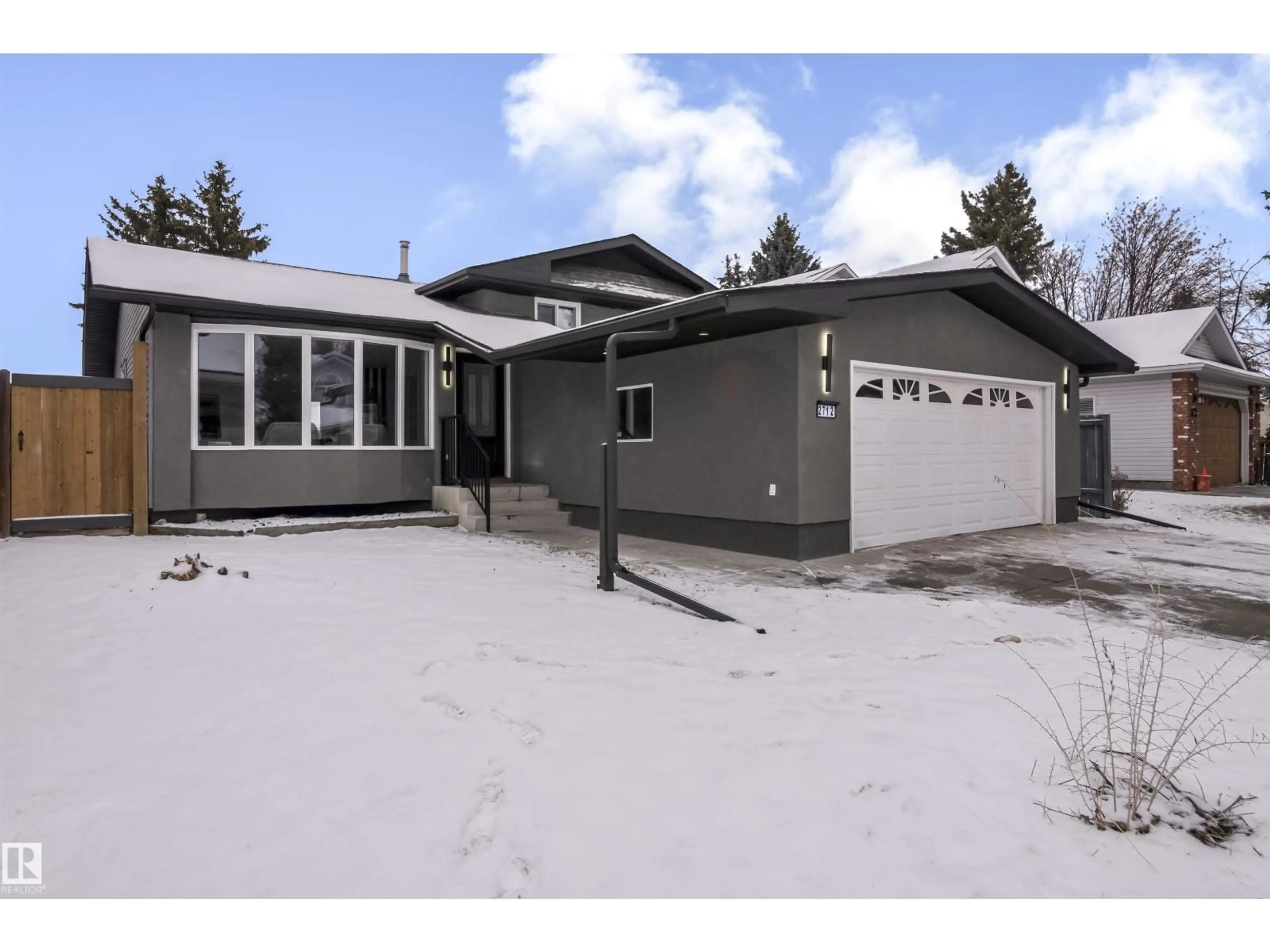 Home with vinyl exterior material, street for 2712 41 ST, Edmonton Alberta T6L4H1