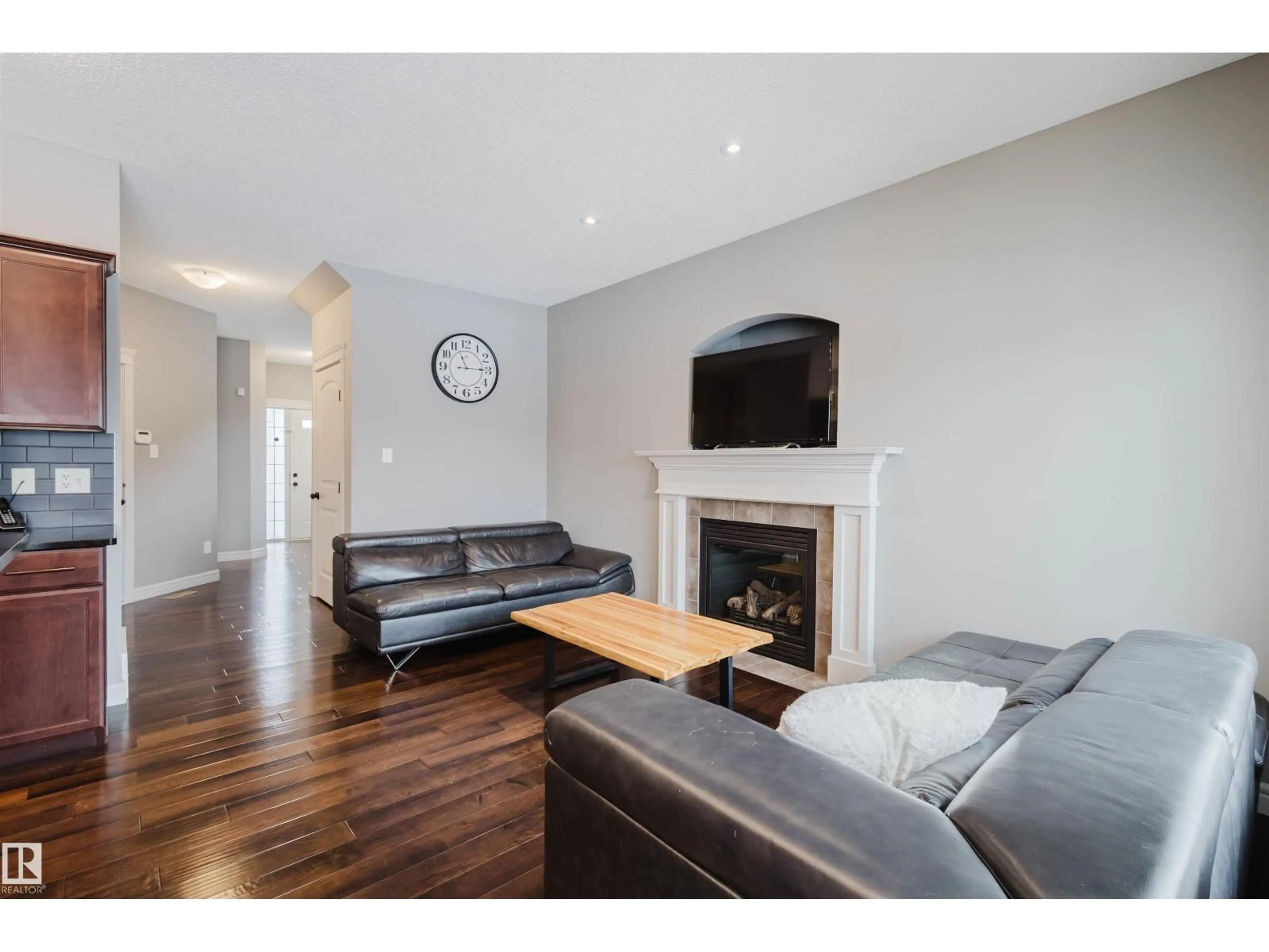 Living room with furniture, wood/laminate floor for 3921 167A AV, Edmonton Alberta T5Y0X9