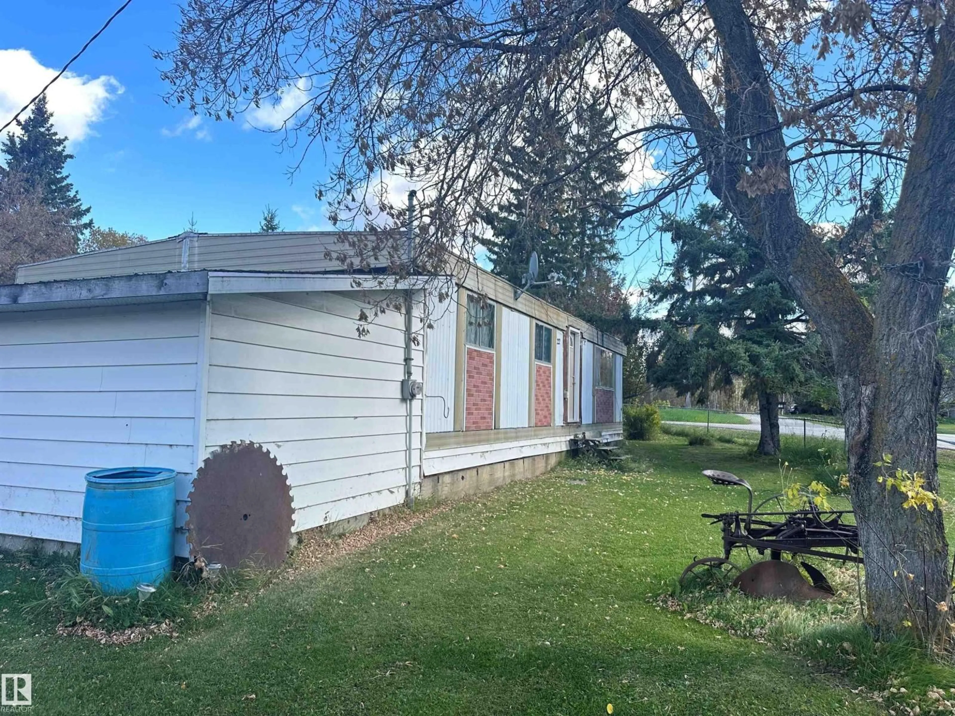 A pic from outside/outdoor area/front of a property/back of a property/a pic from drone, street for #22 - 20575 WYE RD, Rural Strathcona County Alberta T8G1H1