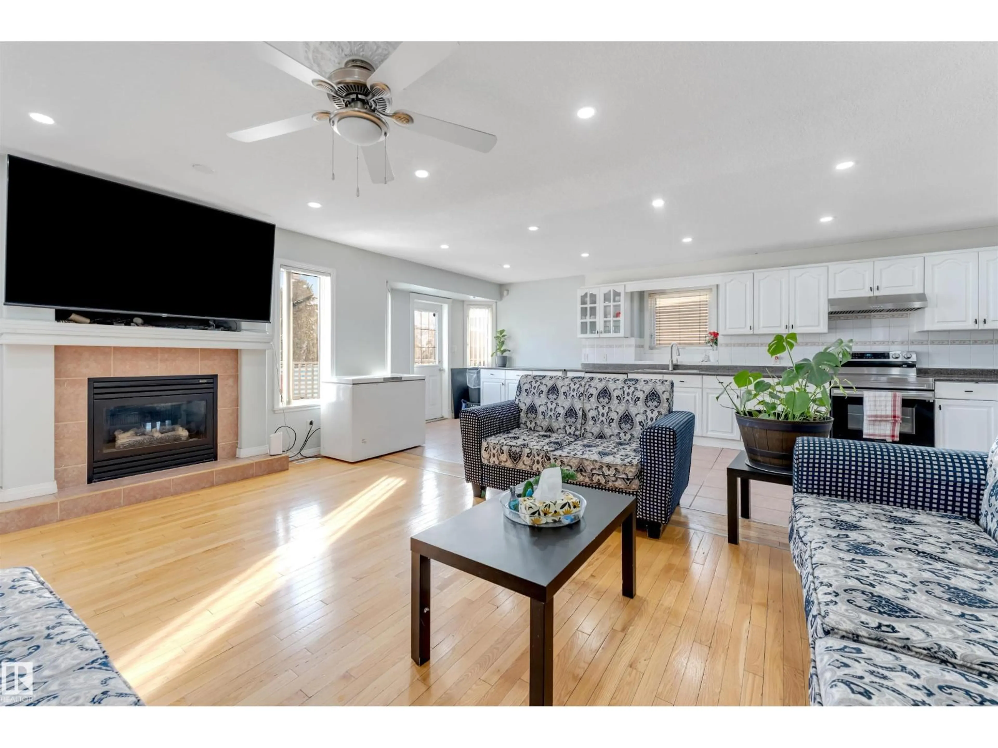 Living room with furniture, wood/laminate floor for 3139 34B AV, Edmonton Alberta T6T1T6