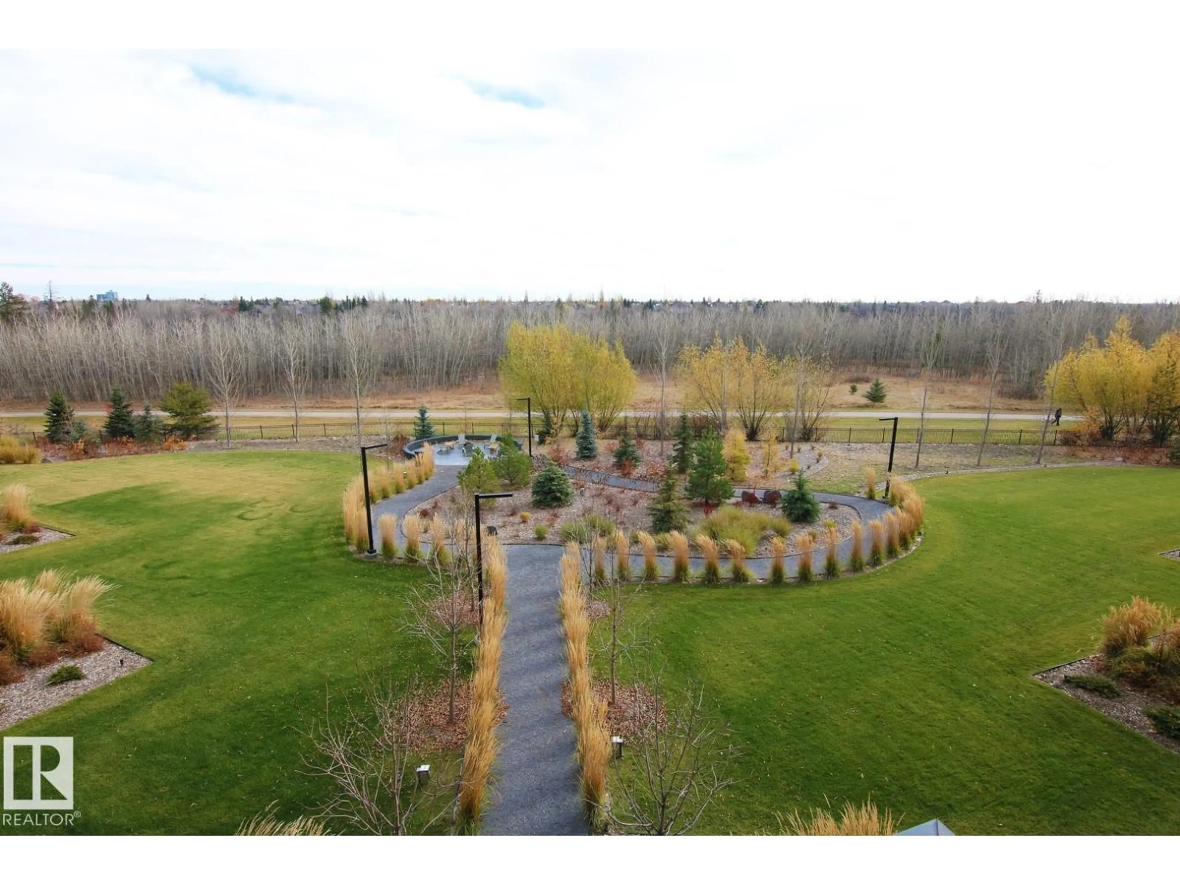 A pic from outside/outdoor area/front of a property/back of a property/a pic from drone, water/lake/river/ocean view for #311 - 7463 MAY CM, Edmonton Alberta T6R0X1