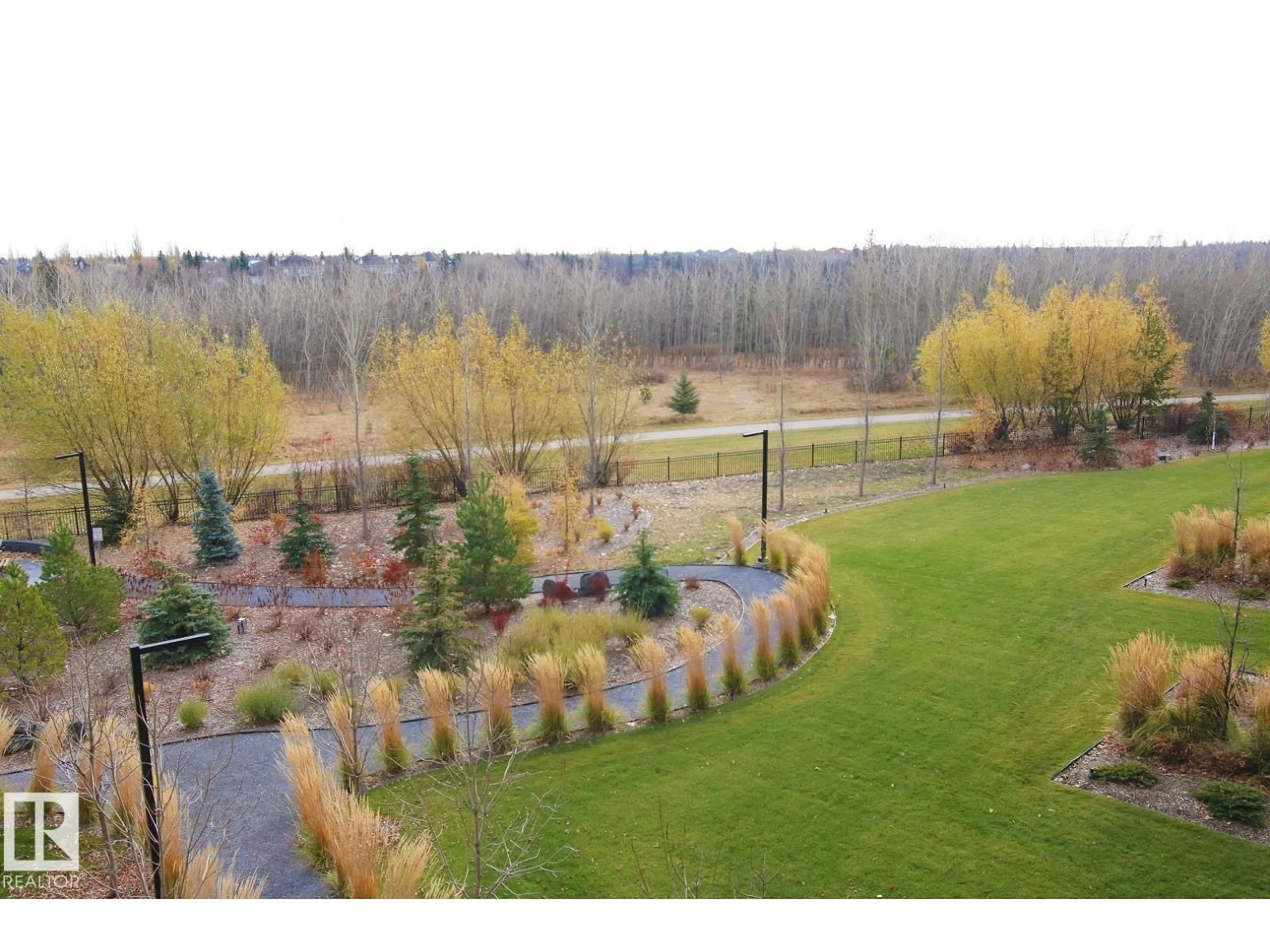 A pic from outside/outdoor area/front of a property/back of a property/a pic from drone, forest/trees view for #311 - 7463 MAY CM, Edmonton Alberta T6R0X1