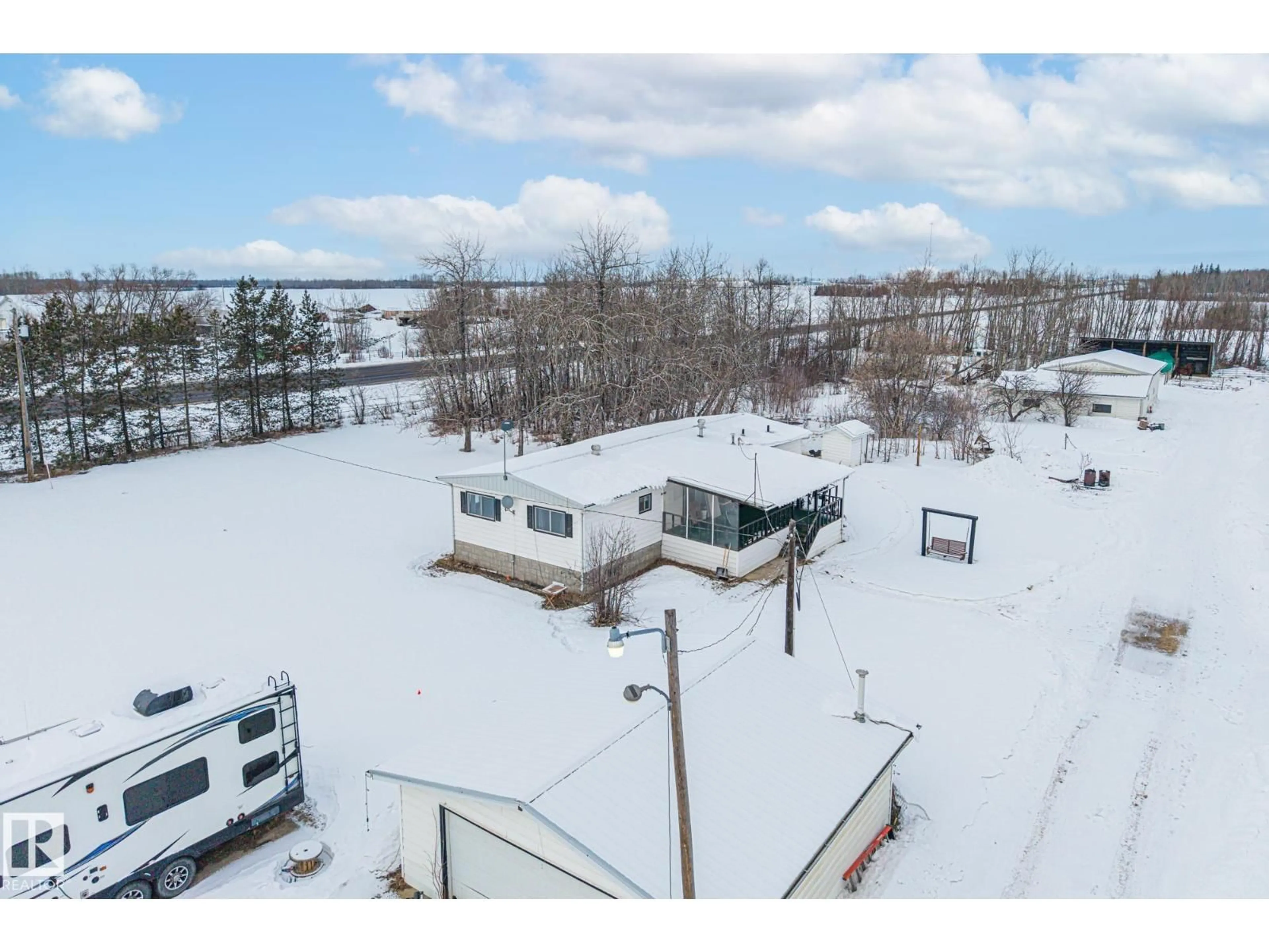A pic from outside/outdoor area/front of a property/back of a property/a pic from drone, unknown for 26332 TWP ROAD 594, Rural Westlock County Alberta T7P2P5