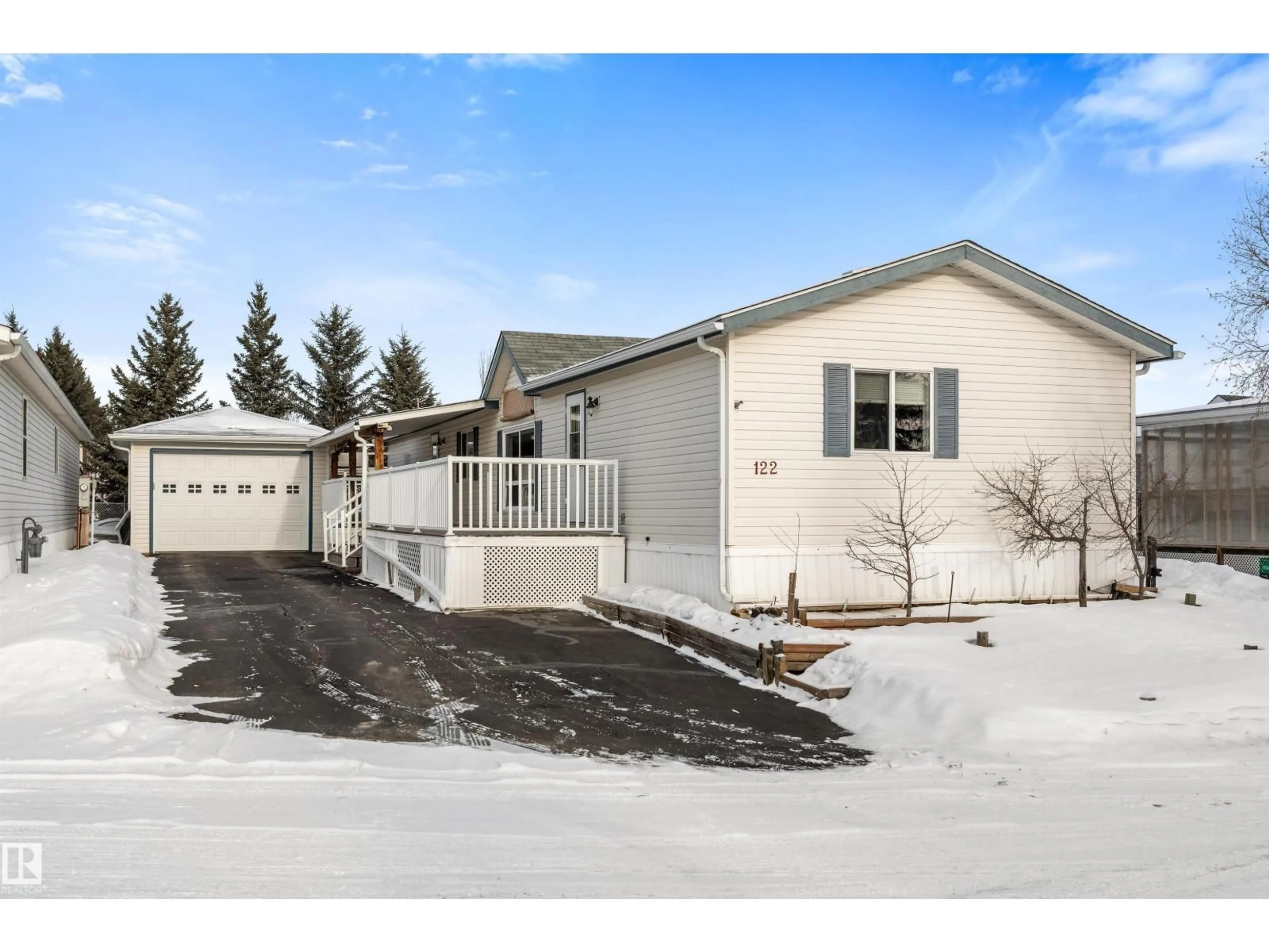 Home with vinyl exterior material, street for #122 - 3400 48 ST, Stony Plain Alberta T7Z1V9
