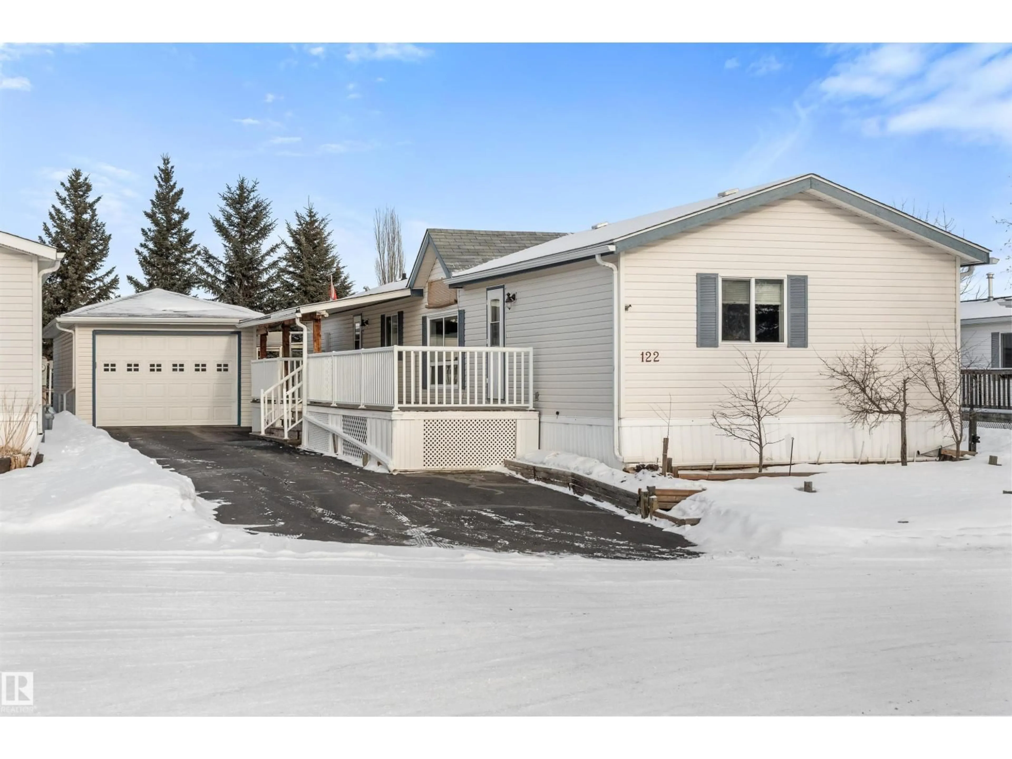 Home with vinyl exterior material, street for #122 - 3400 48 ST, Stony Plain Alberta T7Z1V9