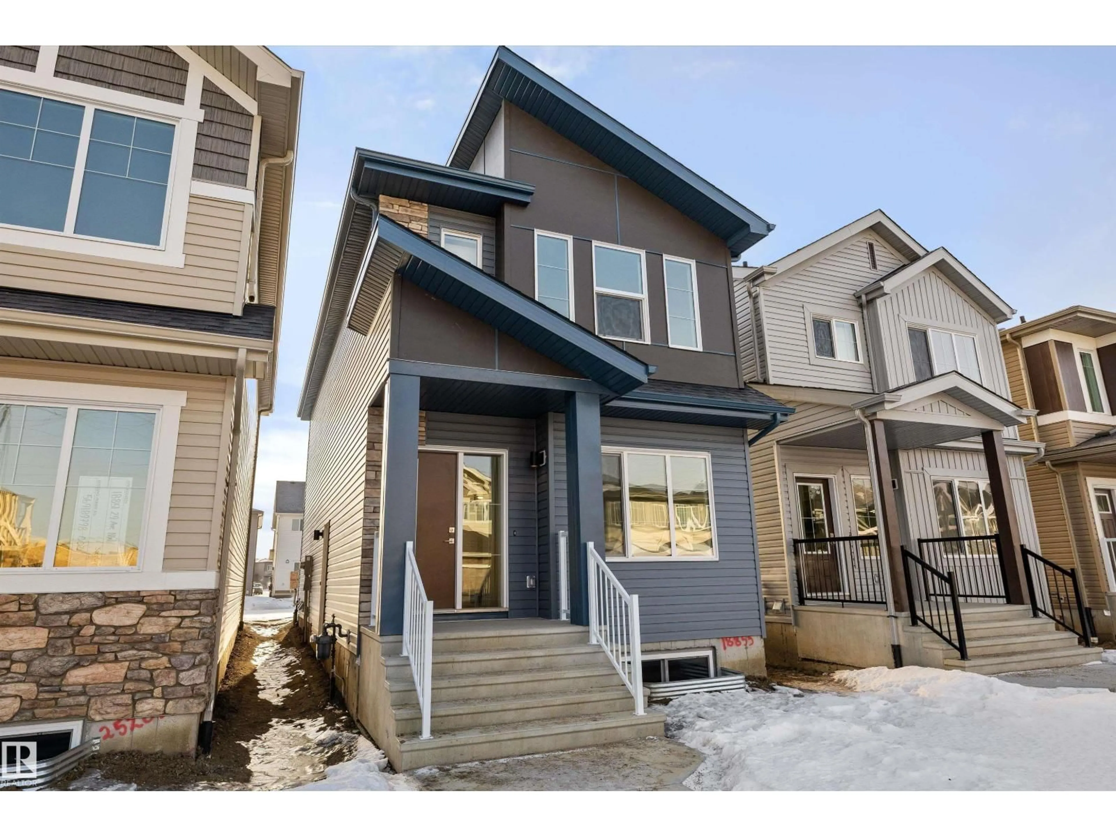 Home with vinyl exterior material, street for 18855 29 AV, Edmonton Alberta T6M3C5