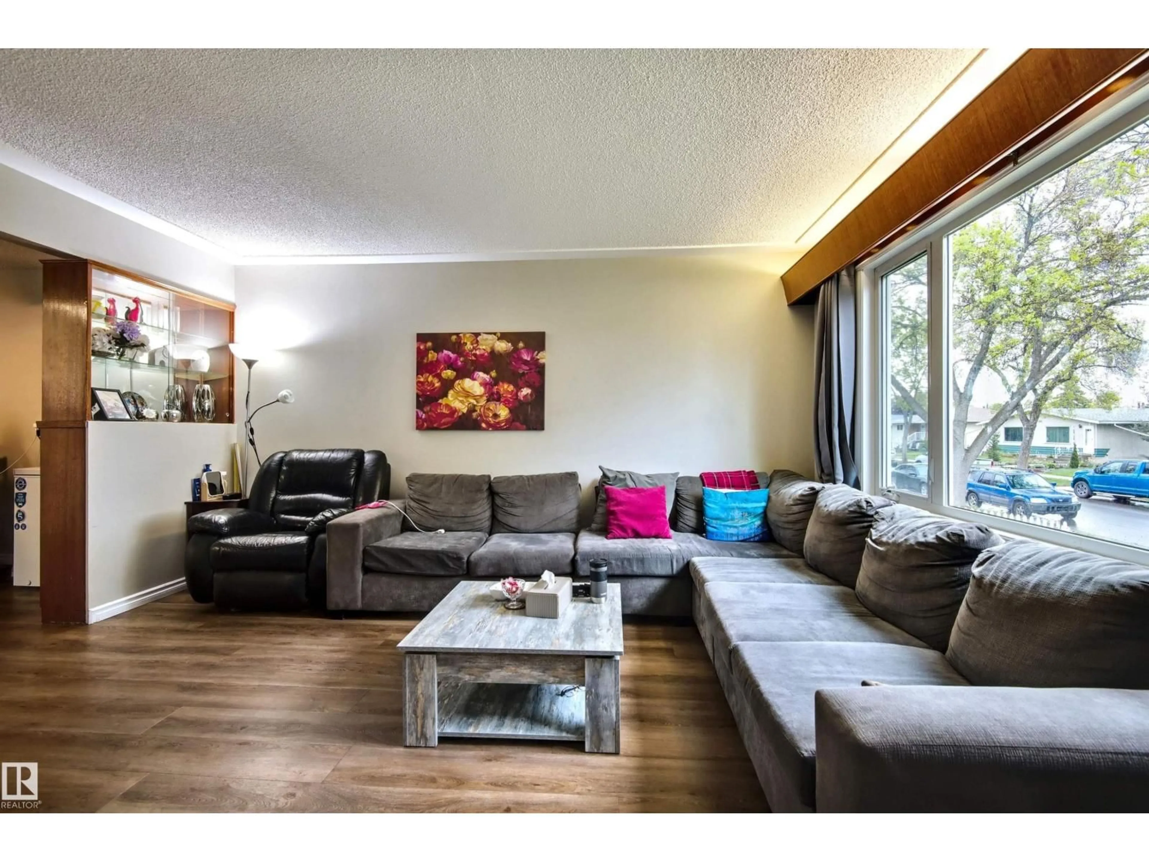 Living room with furniture, wood/laminate floor for NW - 13008-13010 102 ST, Edmonton Alberta T6H4B2