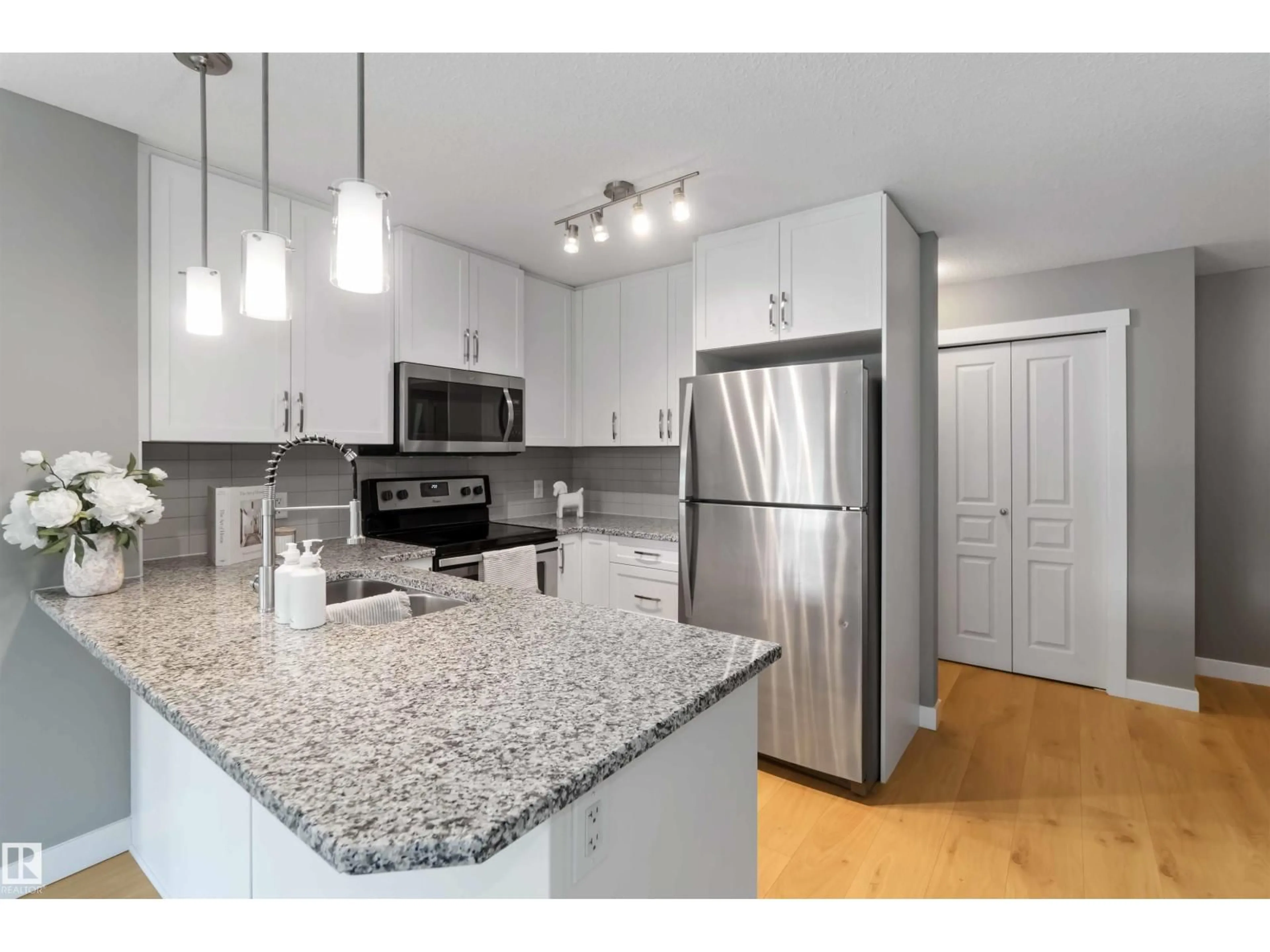 Open concept kitchen, unknown for #101 - 3670 139 AV NW, Edmonton Alberta T5Y3N5
