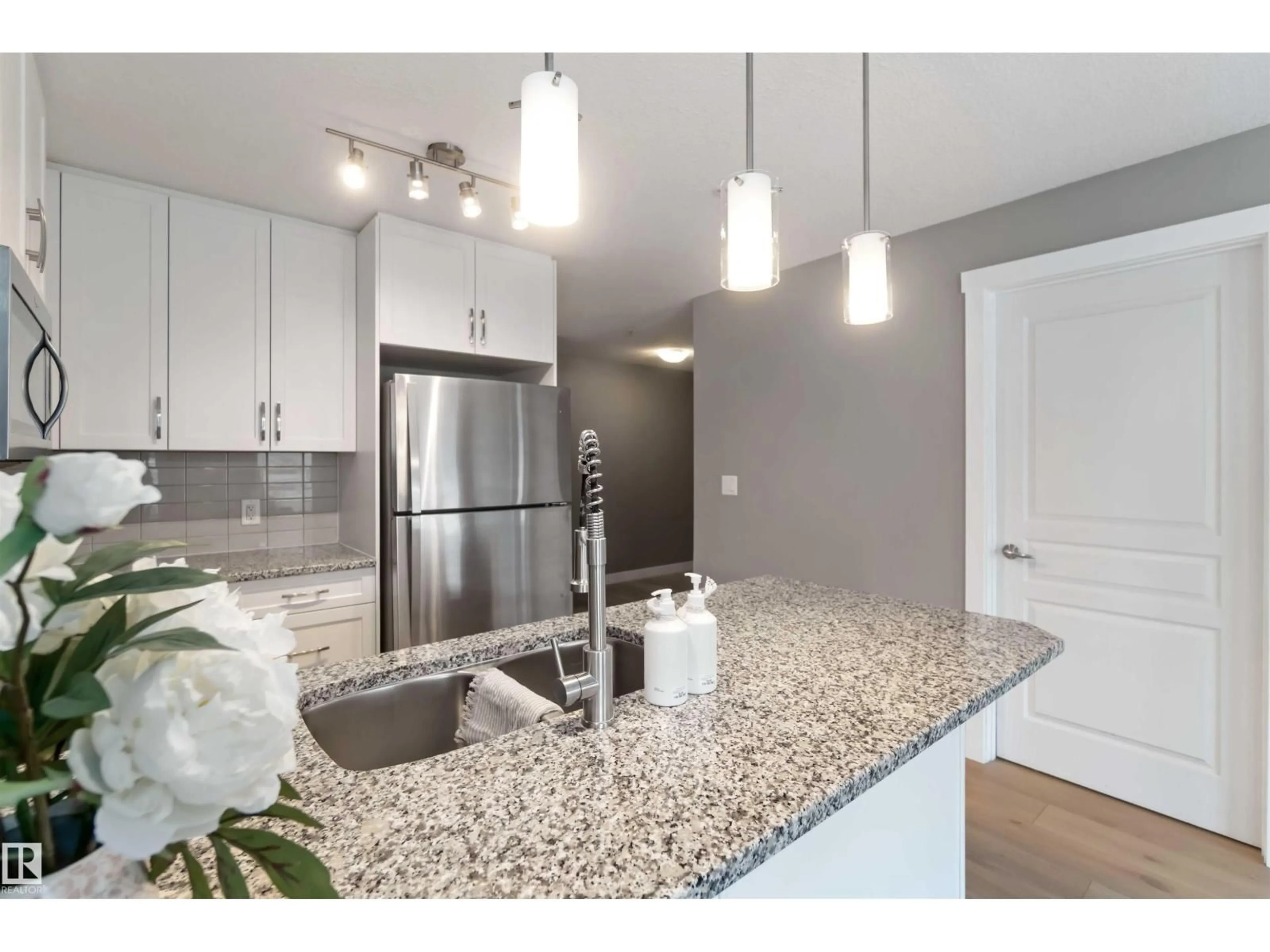 Open concept kitchen, unknown for #101 - 3670 139 AV NW, Edmonton Alberta T5Y3N5