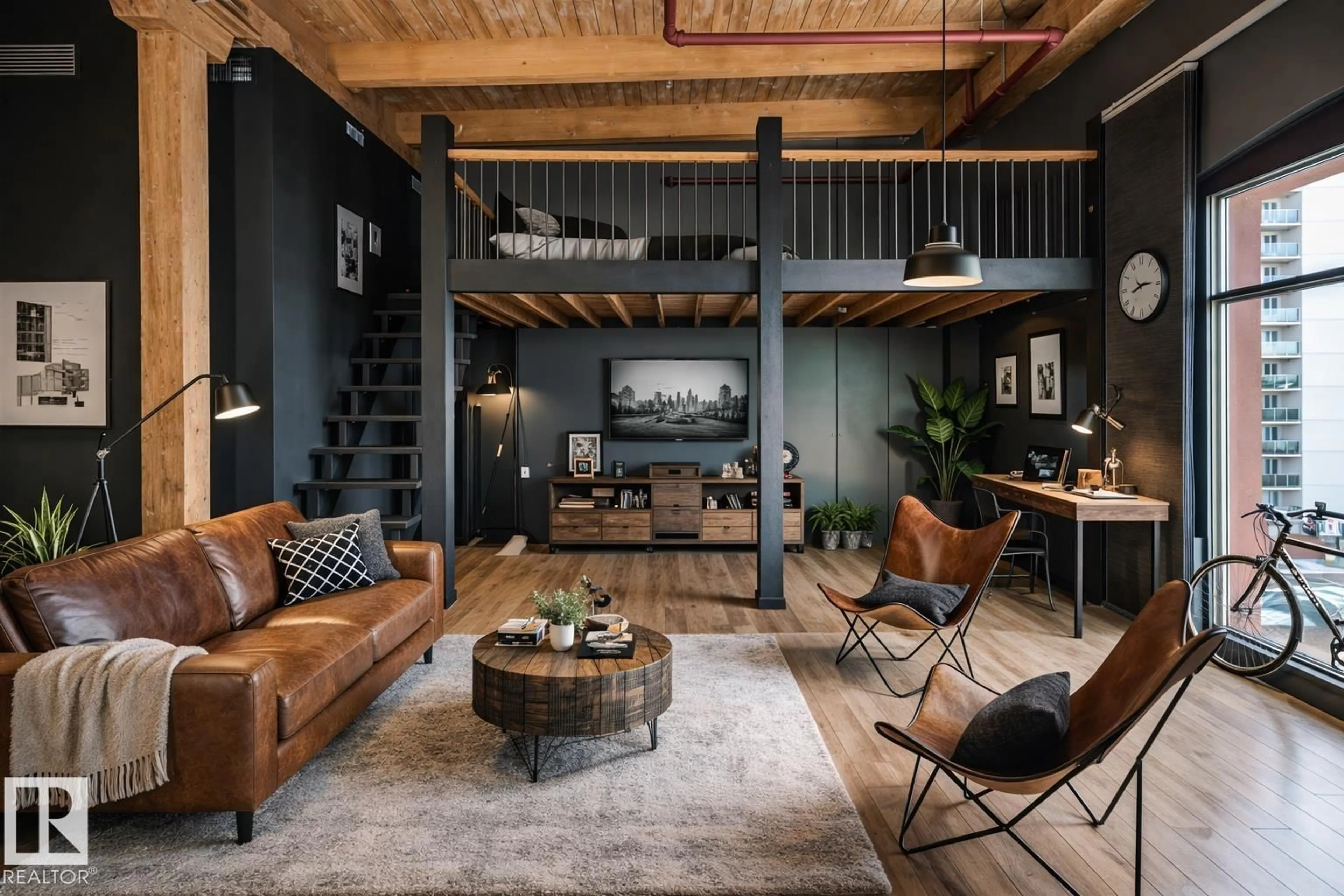 Living room with furniture, cement floor for 407 - 10301 109 ST, Edmonton Alberta T5J1N4