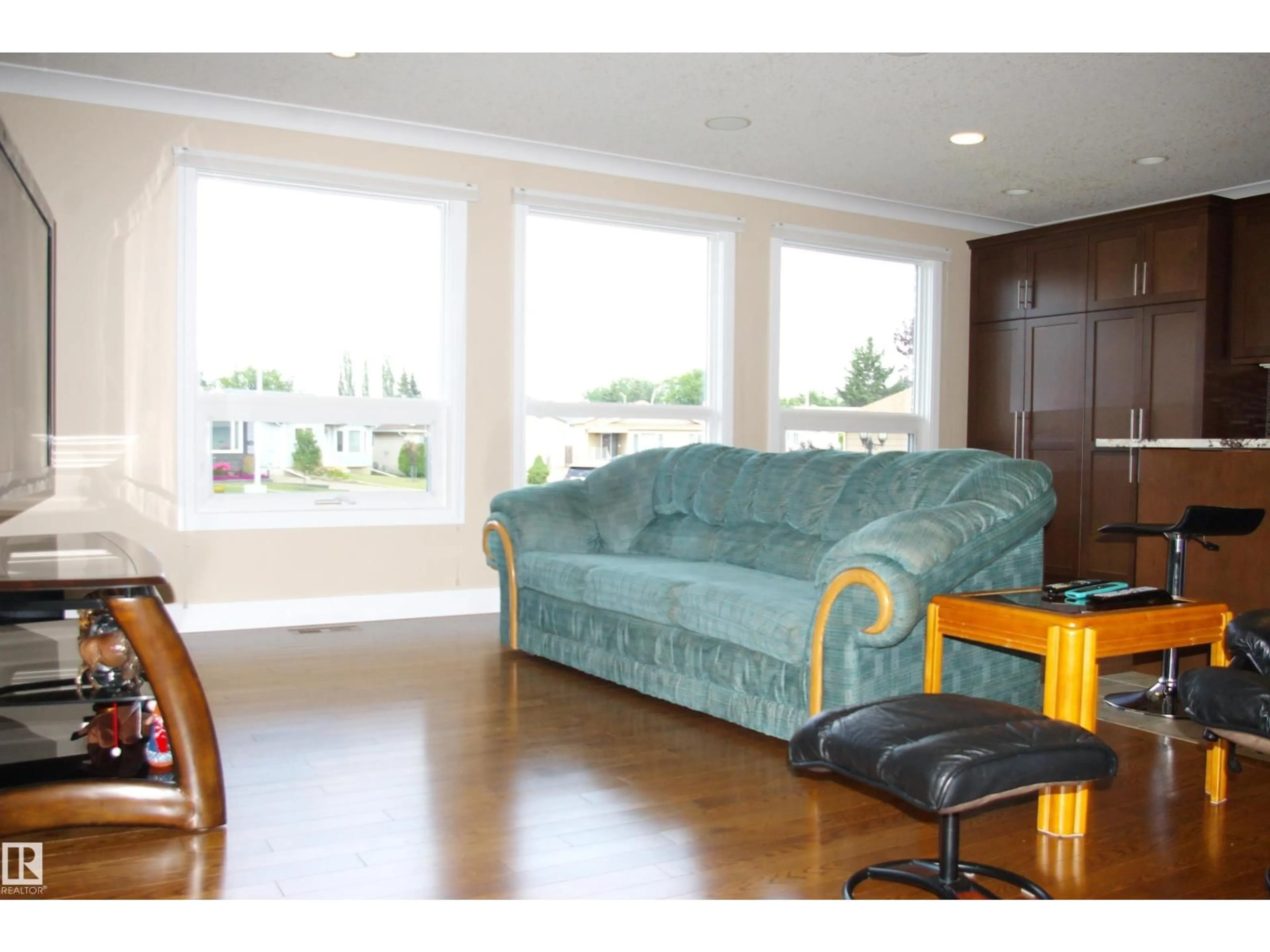 Living room with furniture, wood/laminate floor for 168 WARWICK RD, Edmonton Alberta T5X4P8