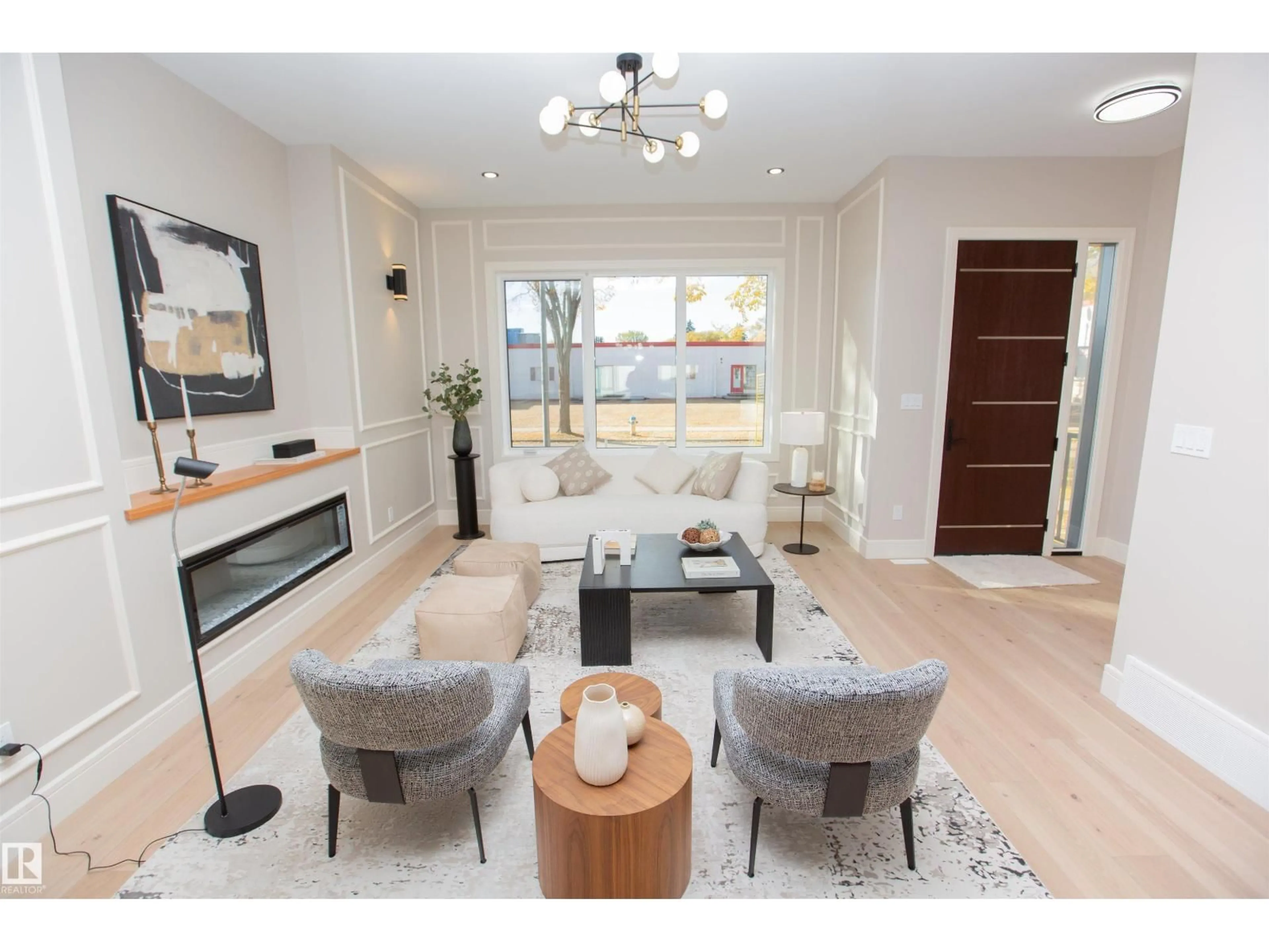 Living room with furniture, wood/laminate floor for 9127 143 ST, Edmonton Alberta T5R0P5