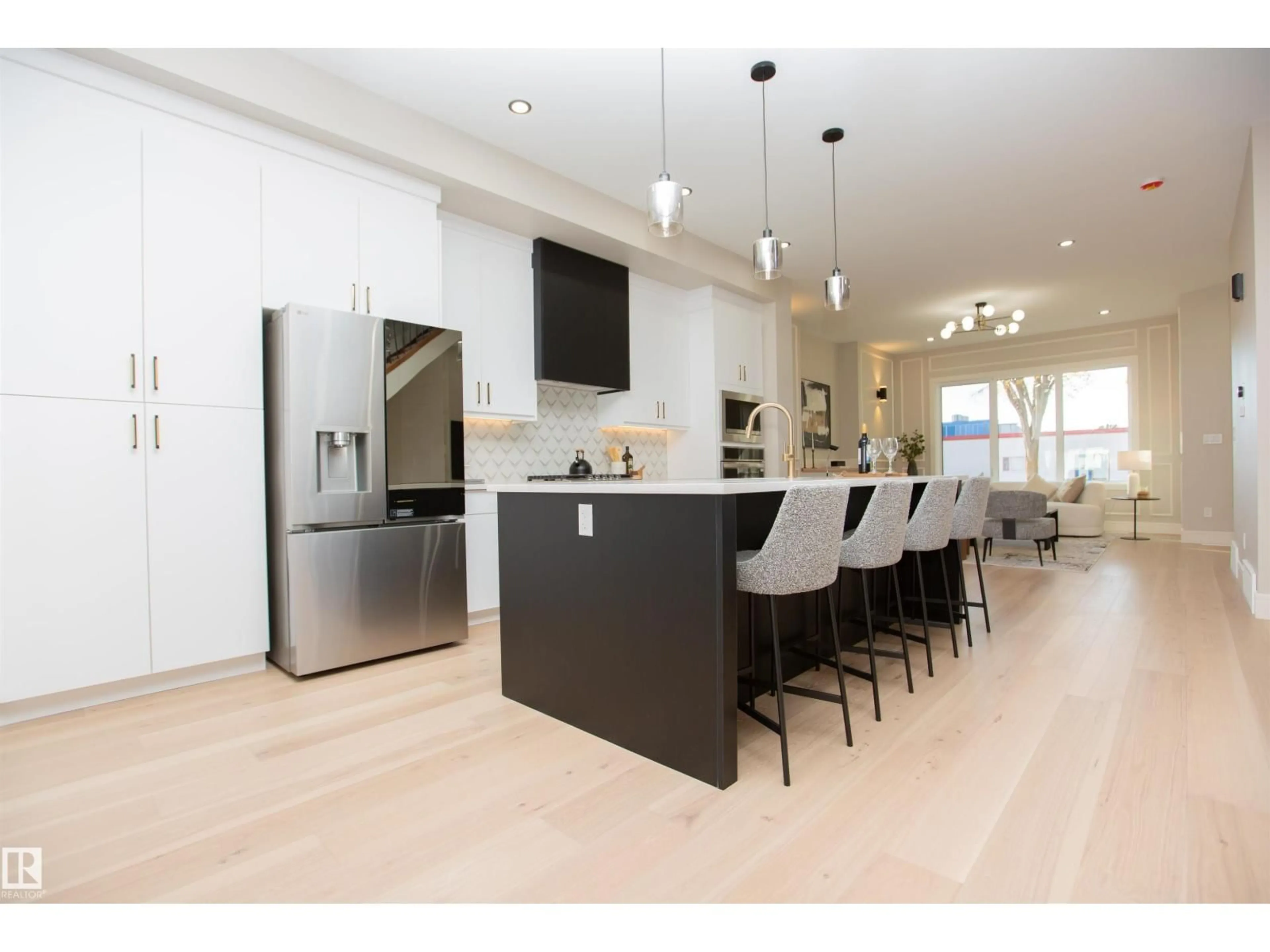 Open concept kitchen, wood/laminate floor for 9127 143 ST, Edmonton Alberta T5R0P5