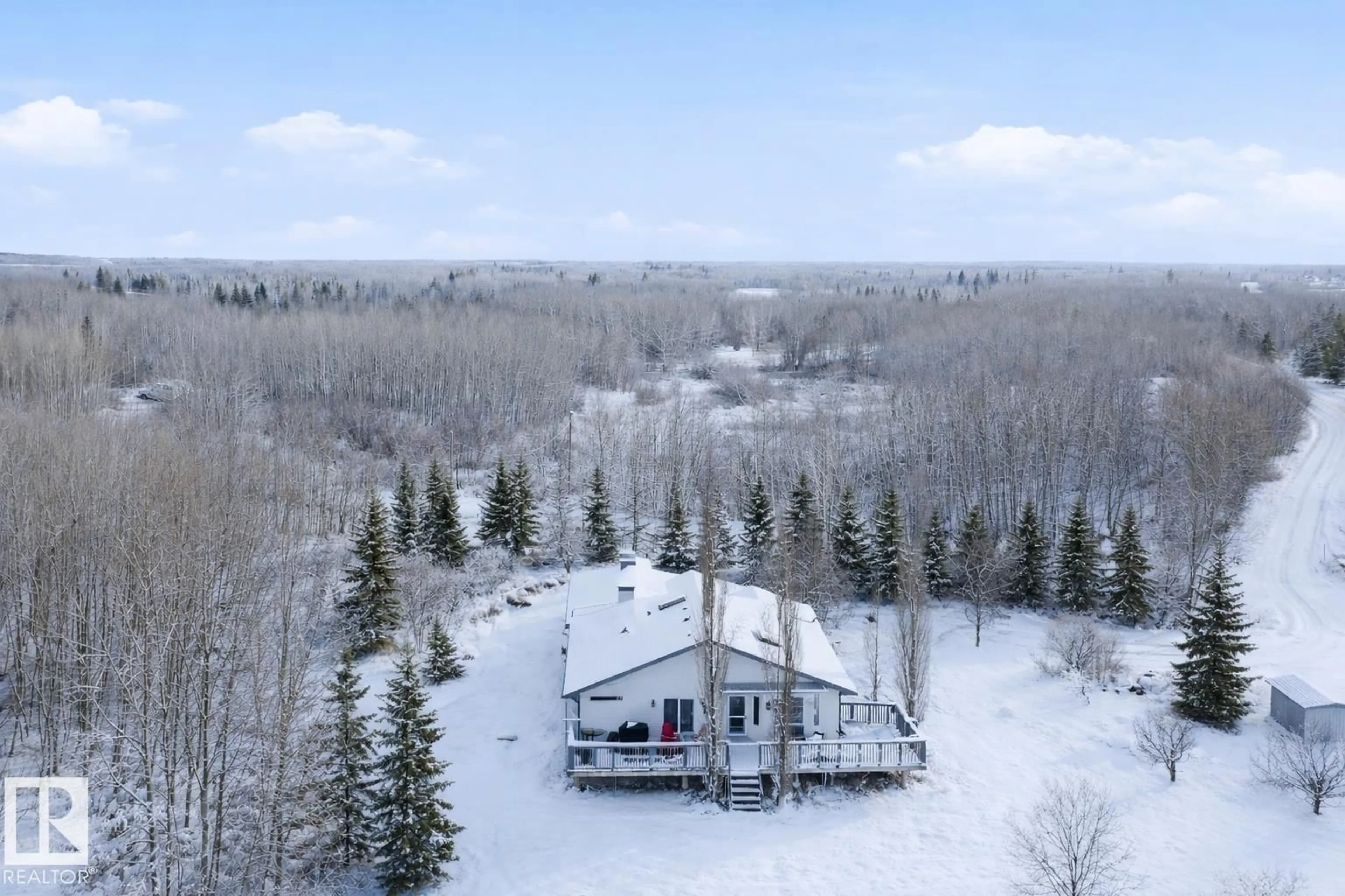 A pic from outside/outdoor area/front of a property/back of a property/a pic from drone, forest/trees view for 50247 RGE RD 232, Rural Leduc County Alberta T4X0K9