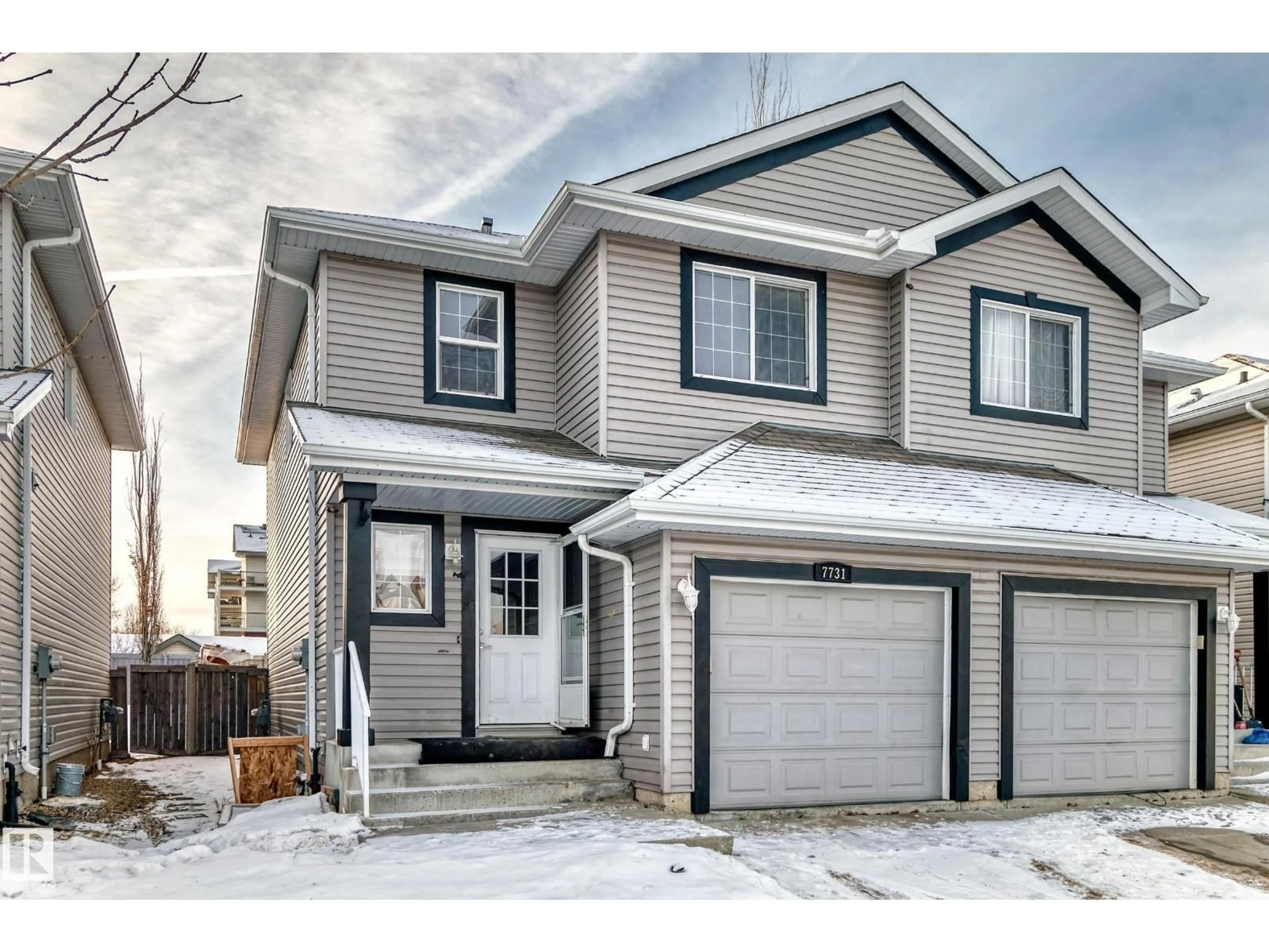 Home with vinyl exterior material, street for 7731 8 AV, Edmonton Alberta T6X0A3