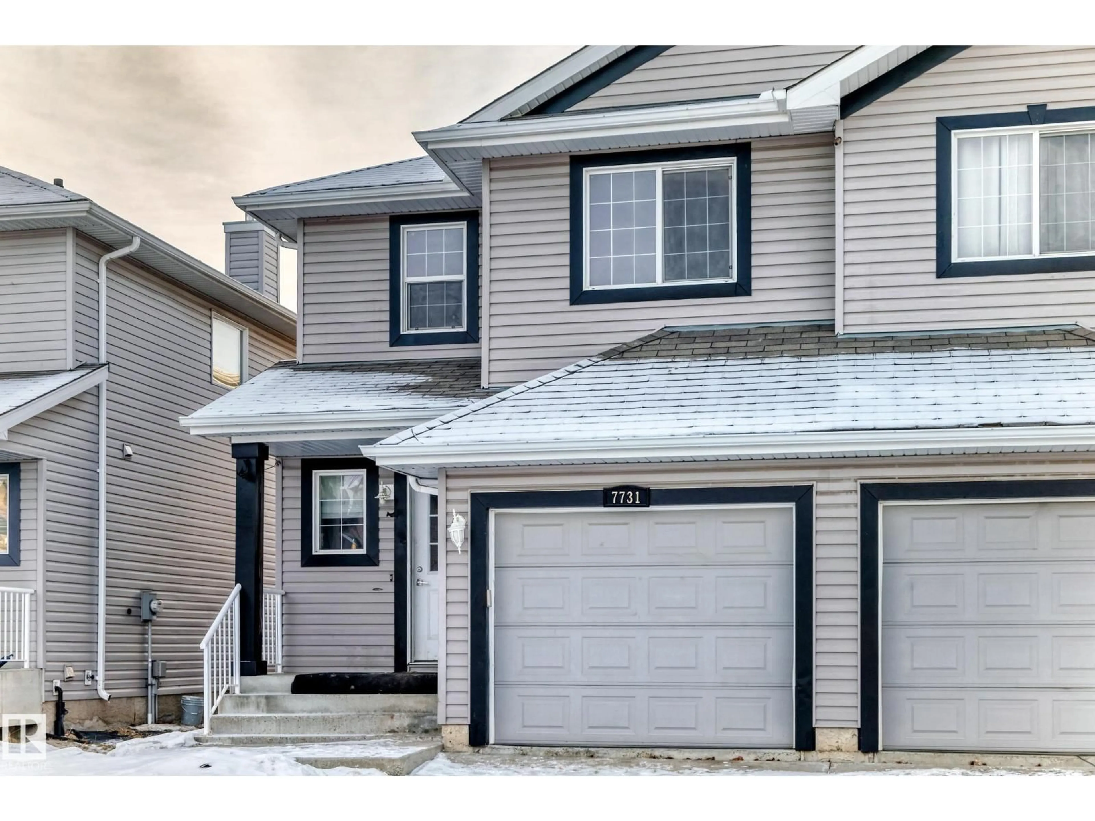Home with vinyl exterior material, street for 7731 8 AV, Edmonton Alberta T6X0A3