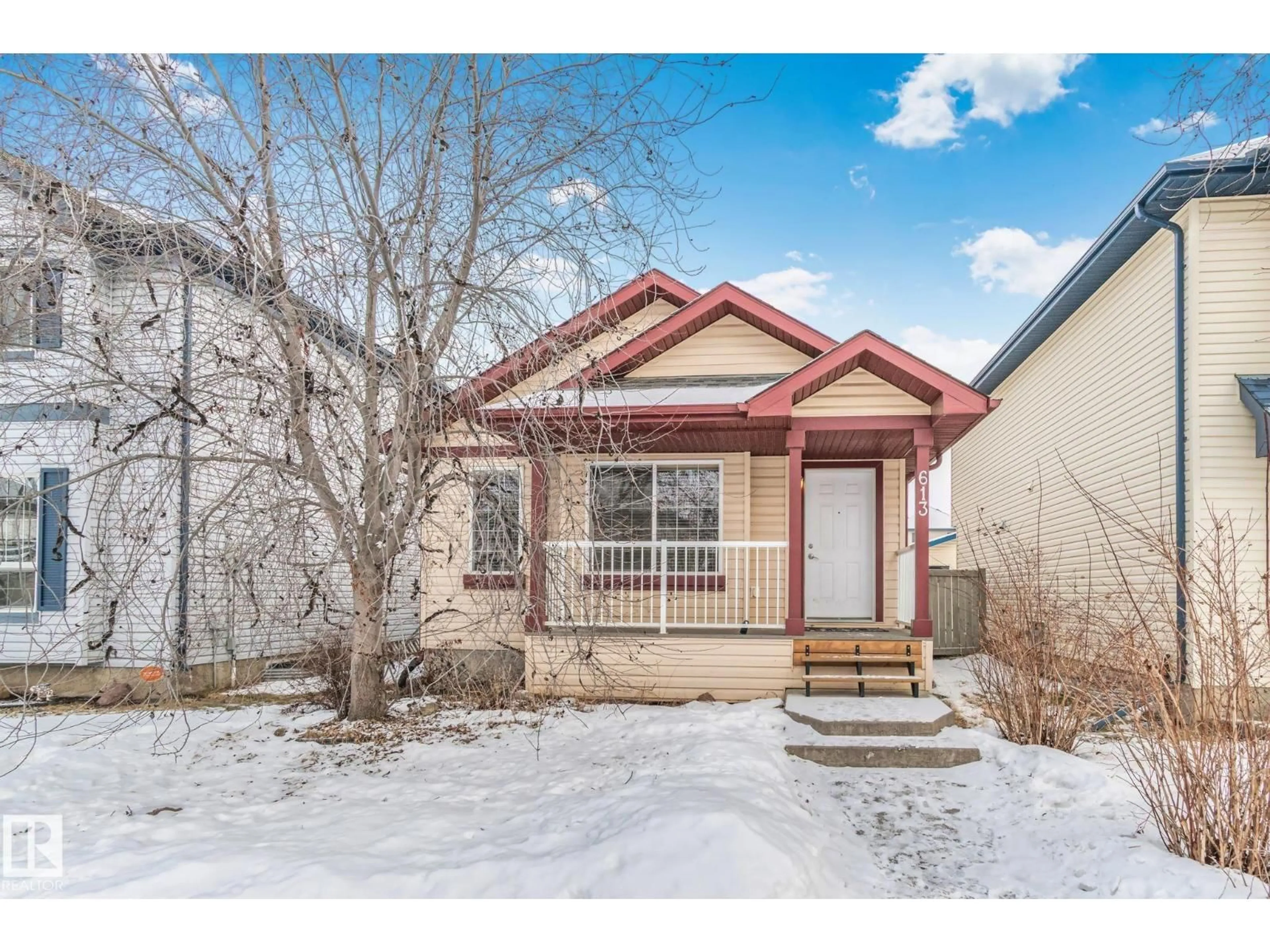 Home with vinyl exterior material, street for 613 83 ST, Edmonton Alberta T6X1L6