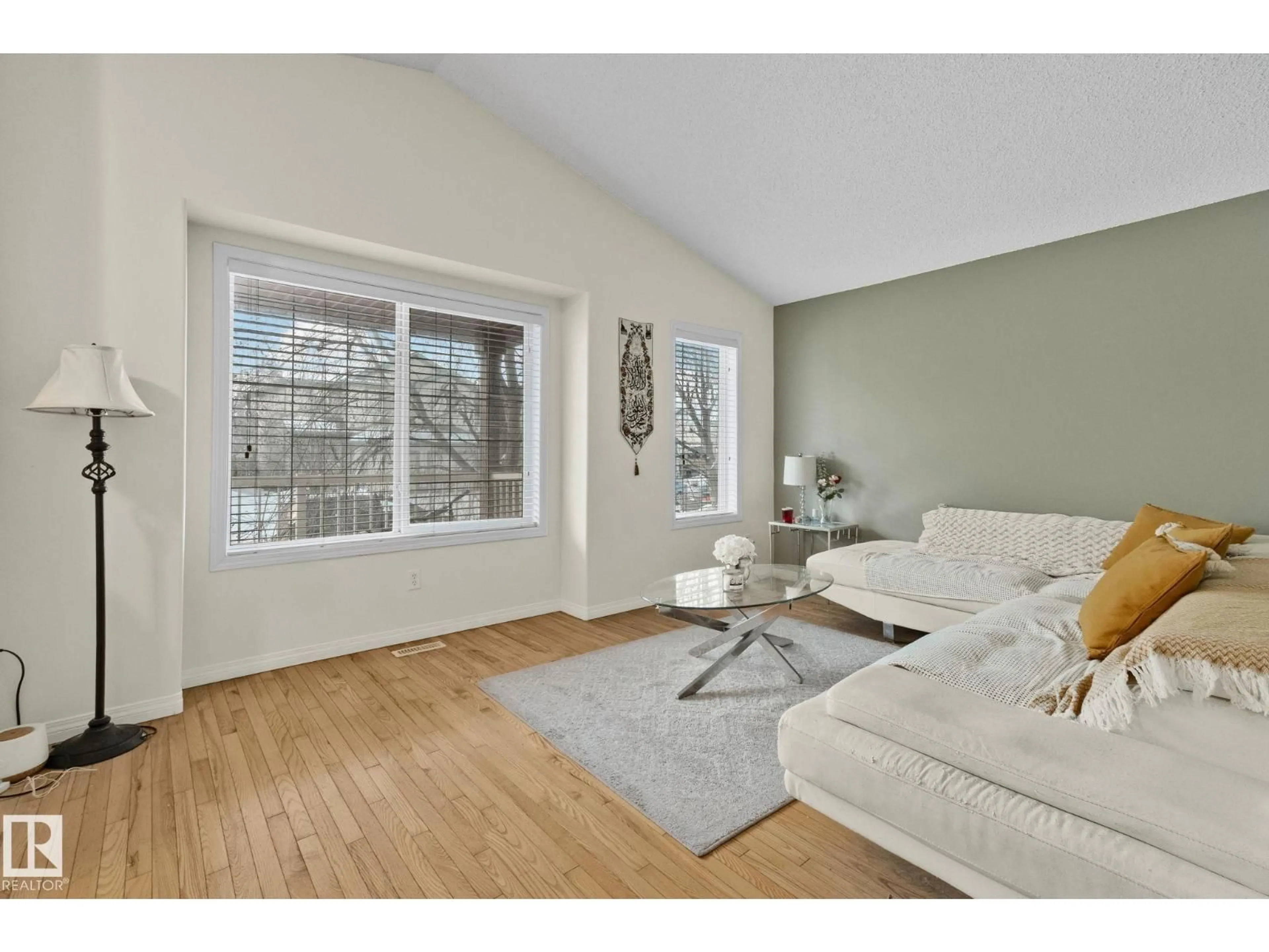 Living room with furniture, wood/laminate floor for 613 83 ST, Edmonton Alberta T6X1L6