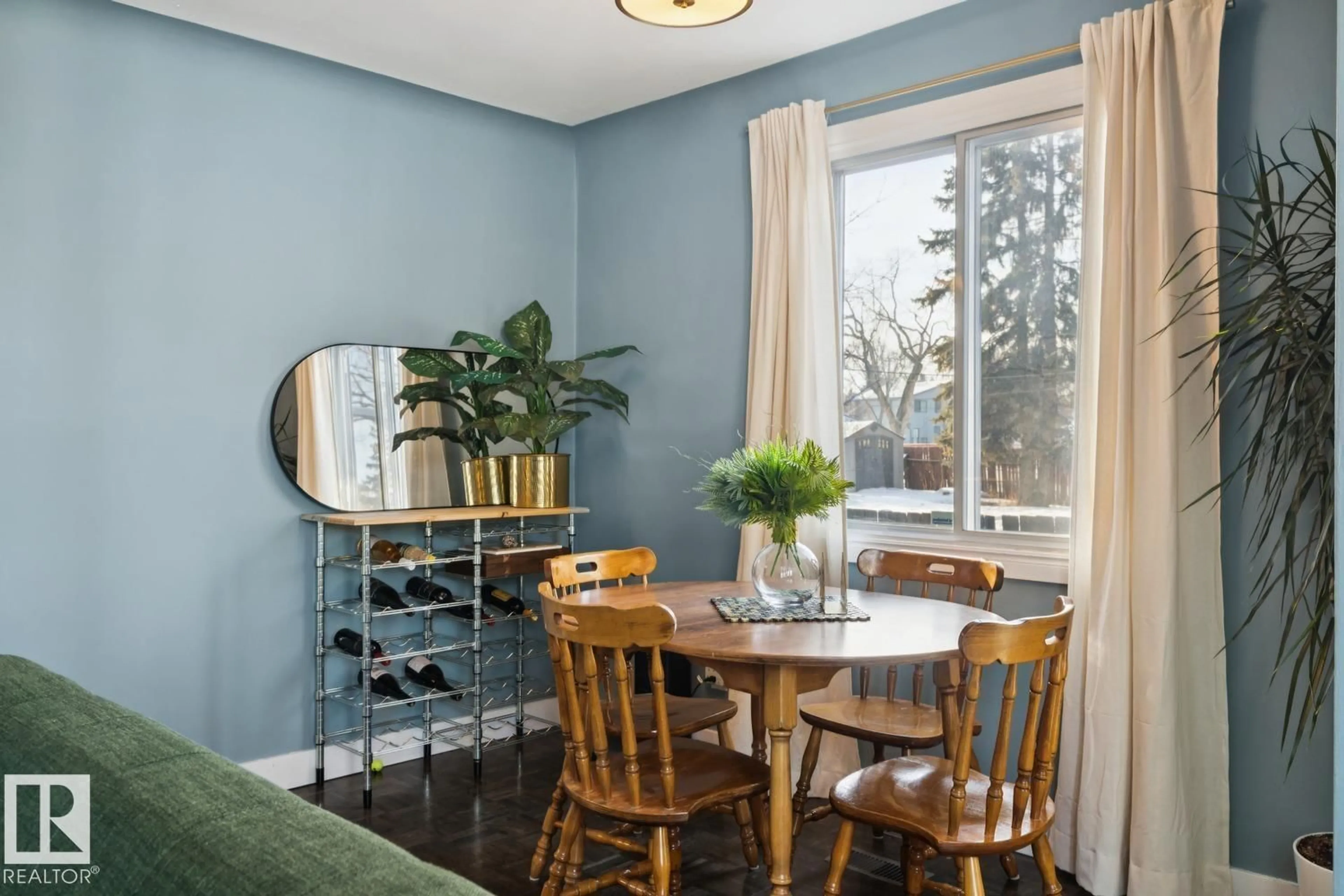 Dining room, wood/laminate floor for 7601 91 AV, Edmonton Alberta T6C1P7