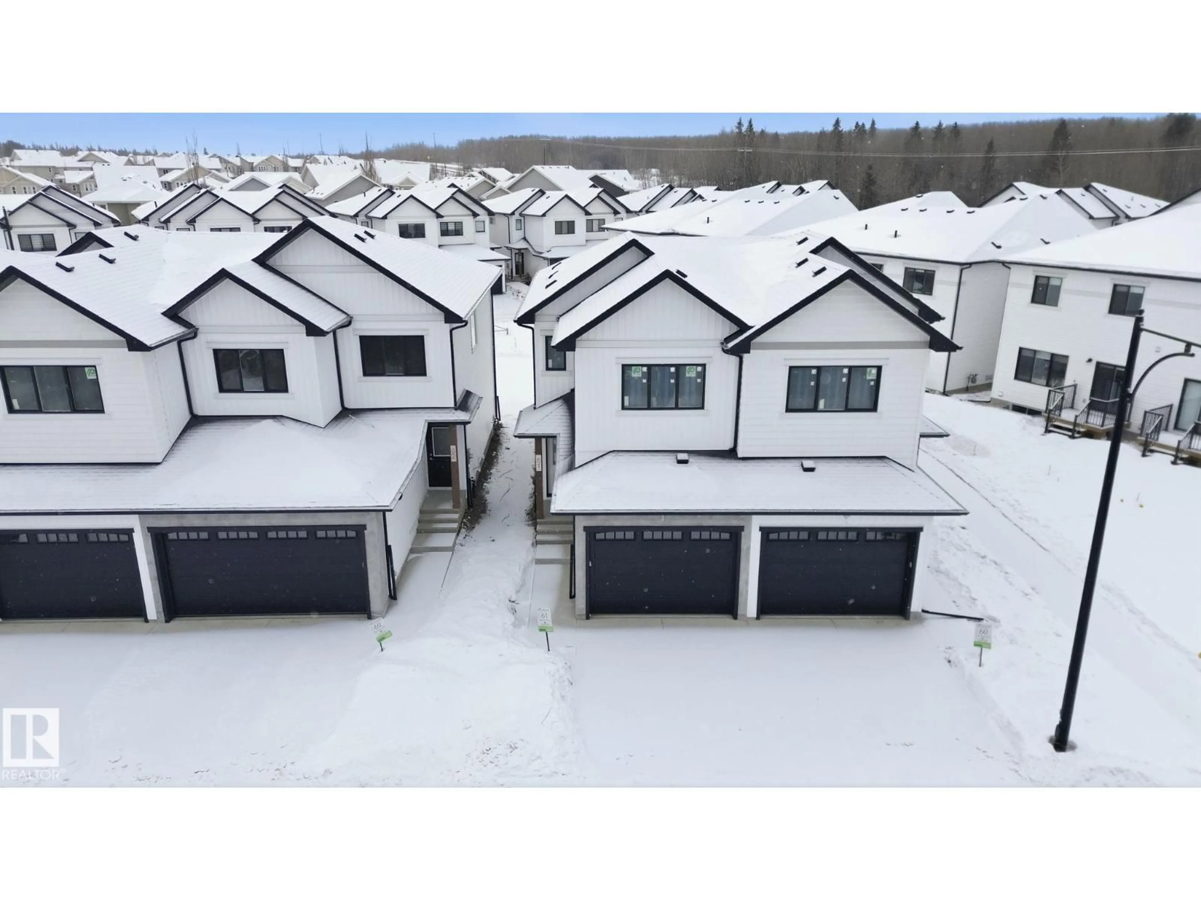 A pic from outside/outdoor area/front of a property/back of a property/a pic from drone, mountain view for #61 - 5122 213A ST, Edmonton Alberta T6M1M6