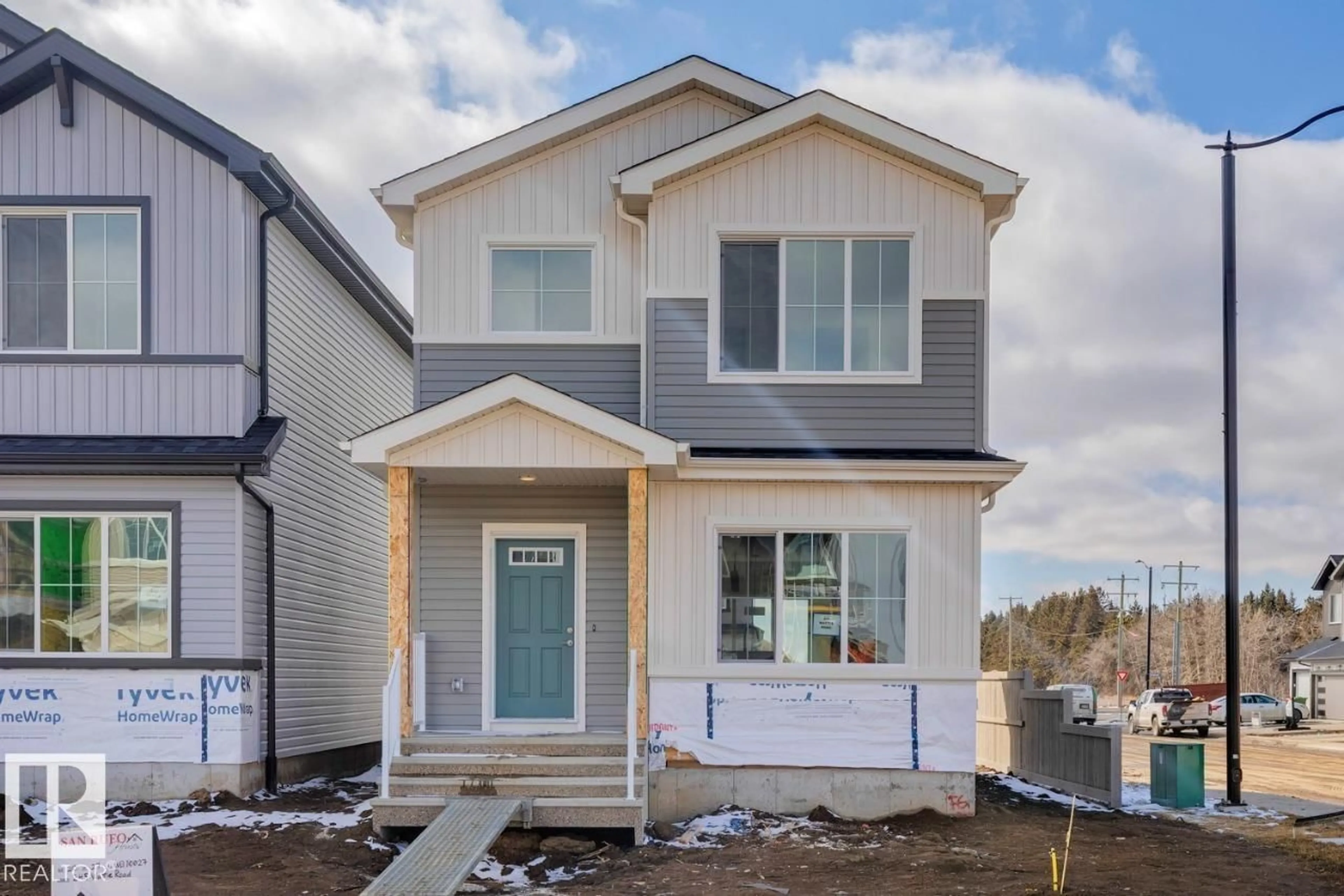 Home with vinyl exterior material, street for 245 WATTLE RD, Leduc Alberta T9E0T7