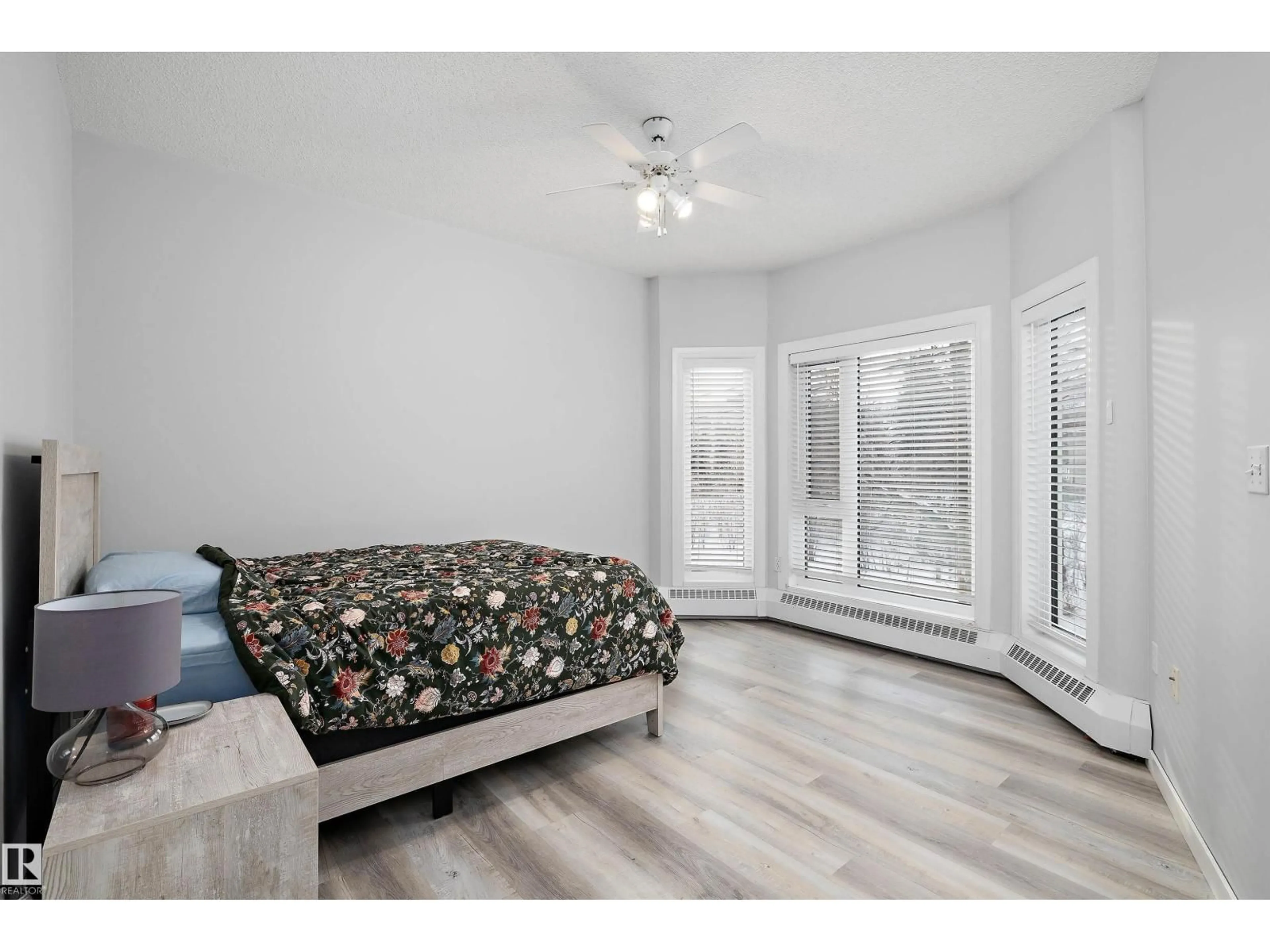 Bedroom with bed, wood/laminate floor for #205 - 10809 SASKATCHEWAN DR, Edmonton Alberta T6E4S5
