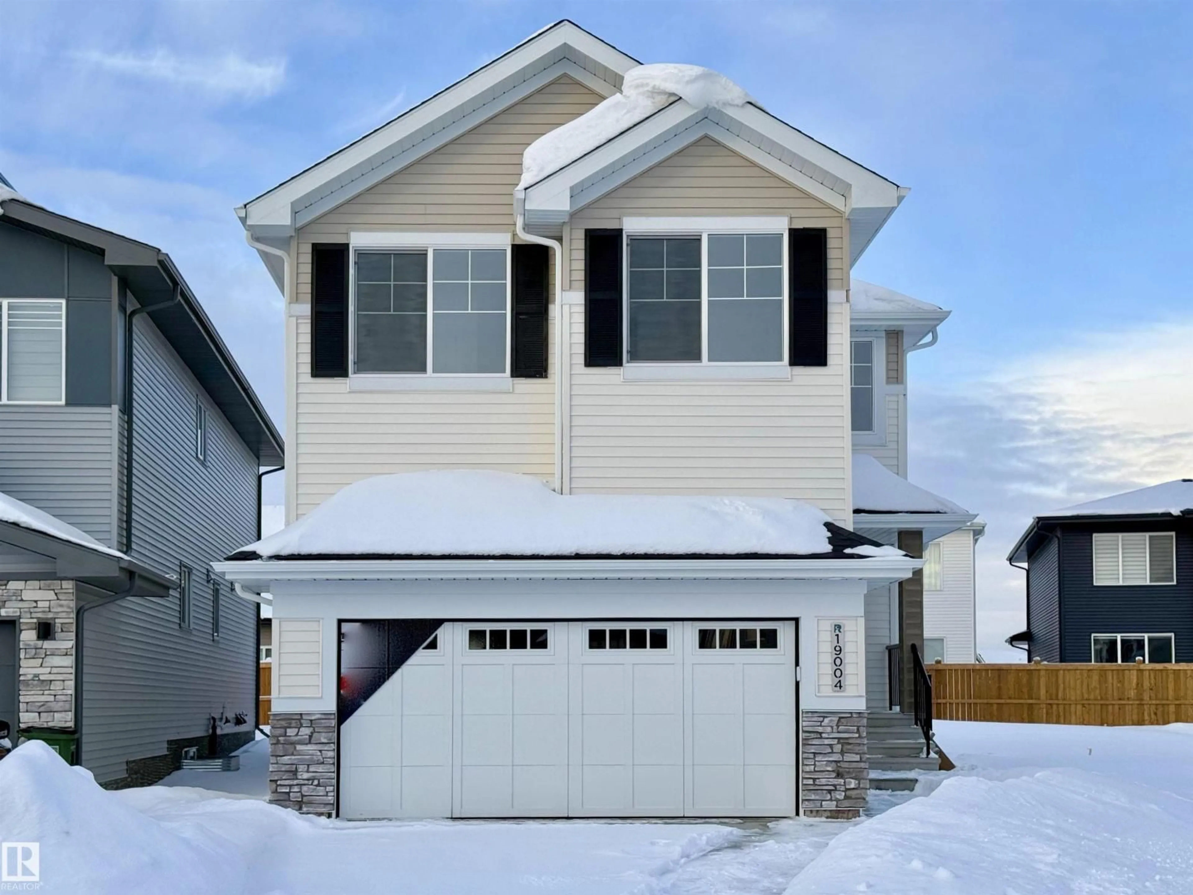 Home with vinyl exterior material, street for 19004 20 AV, Edmonton Alberta T6M3E8