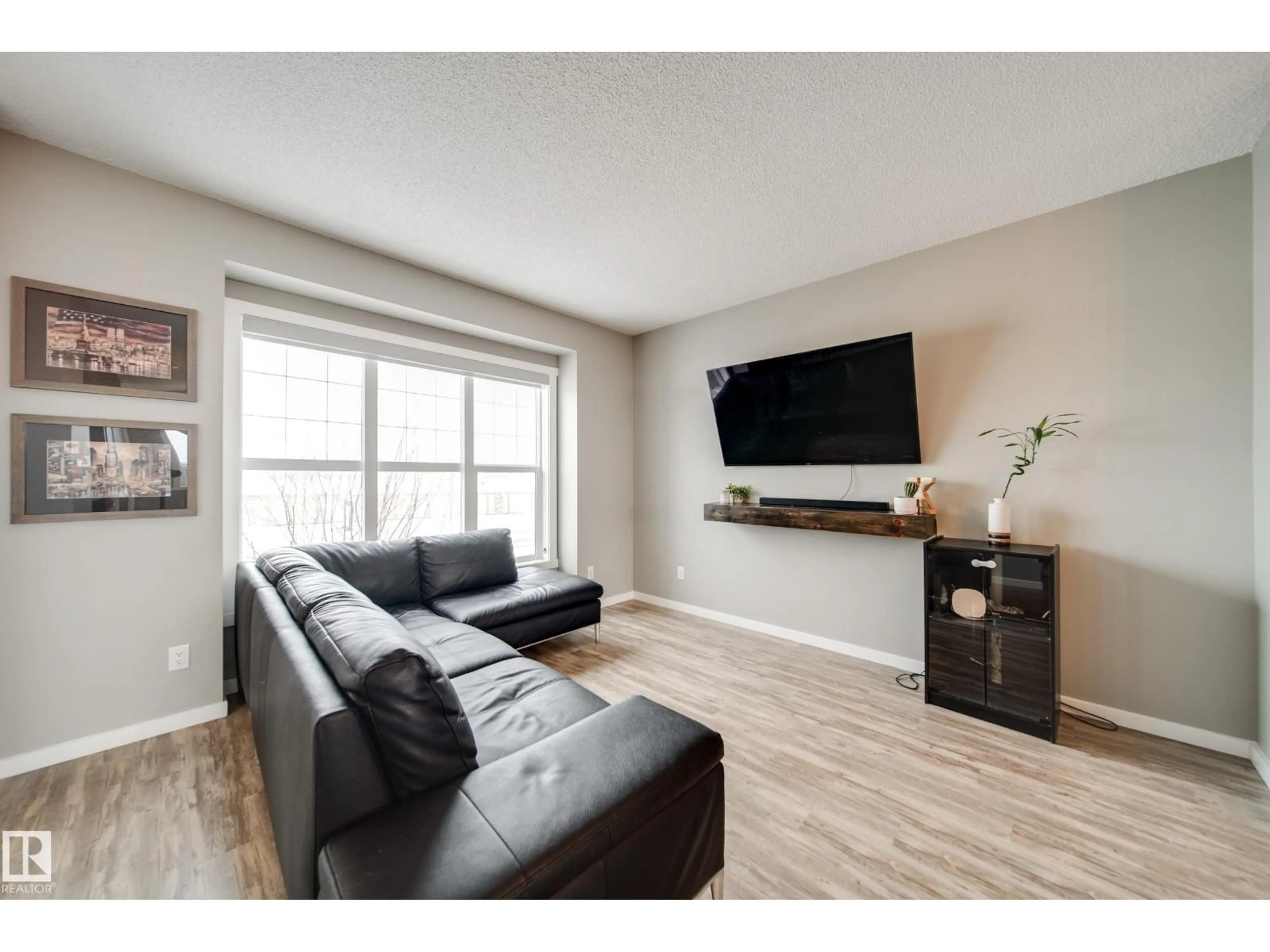 Living room with furniture, wood/laminate floor for 124 SOUTHFORK RD, Leduc Alberta T9E1E2