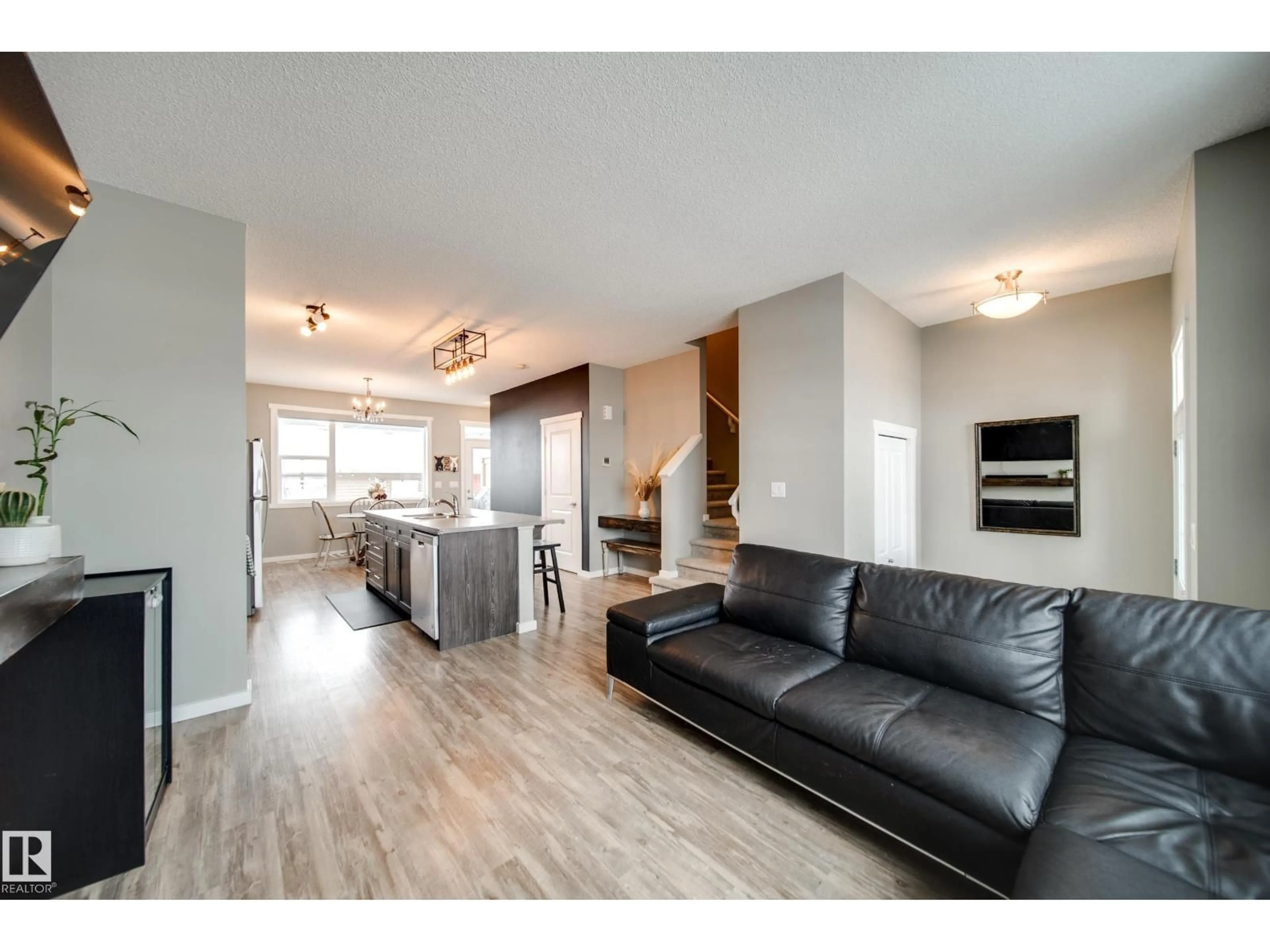 Living room with furniture, wood/laminate floor for 124 SOUTHFORK RD, Leduc Alberta T9E1E2