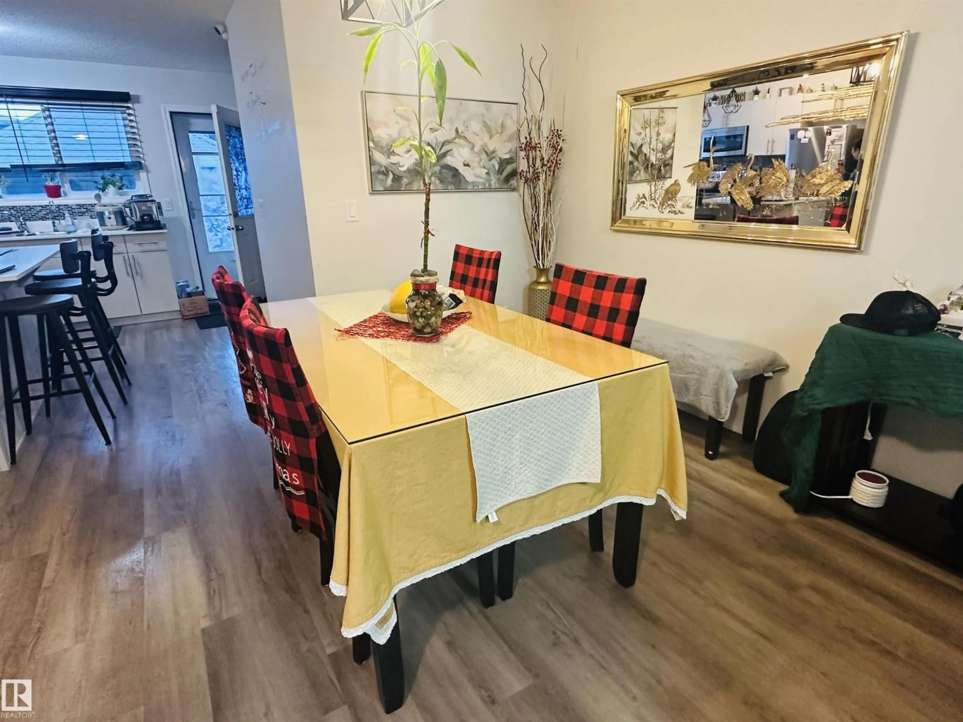 Dining room, wood/laminate floor for 19303 27 AV, Edmonton Alberta T6M1K9