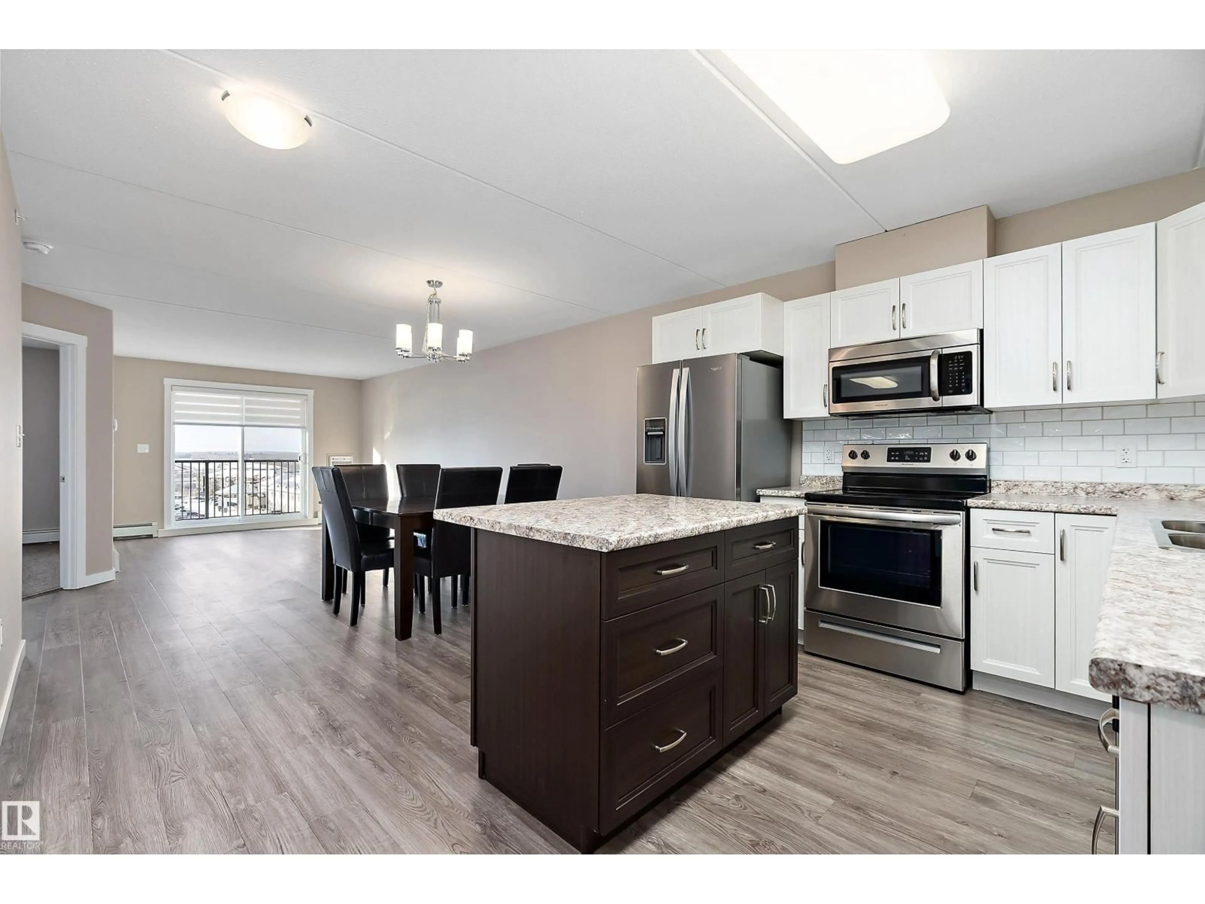 Open concept kitchen, wood/laminate floor for 206 - 4002 47 ST, Drayton Valley Alberta T7A0A2