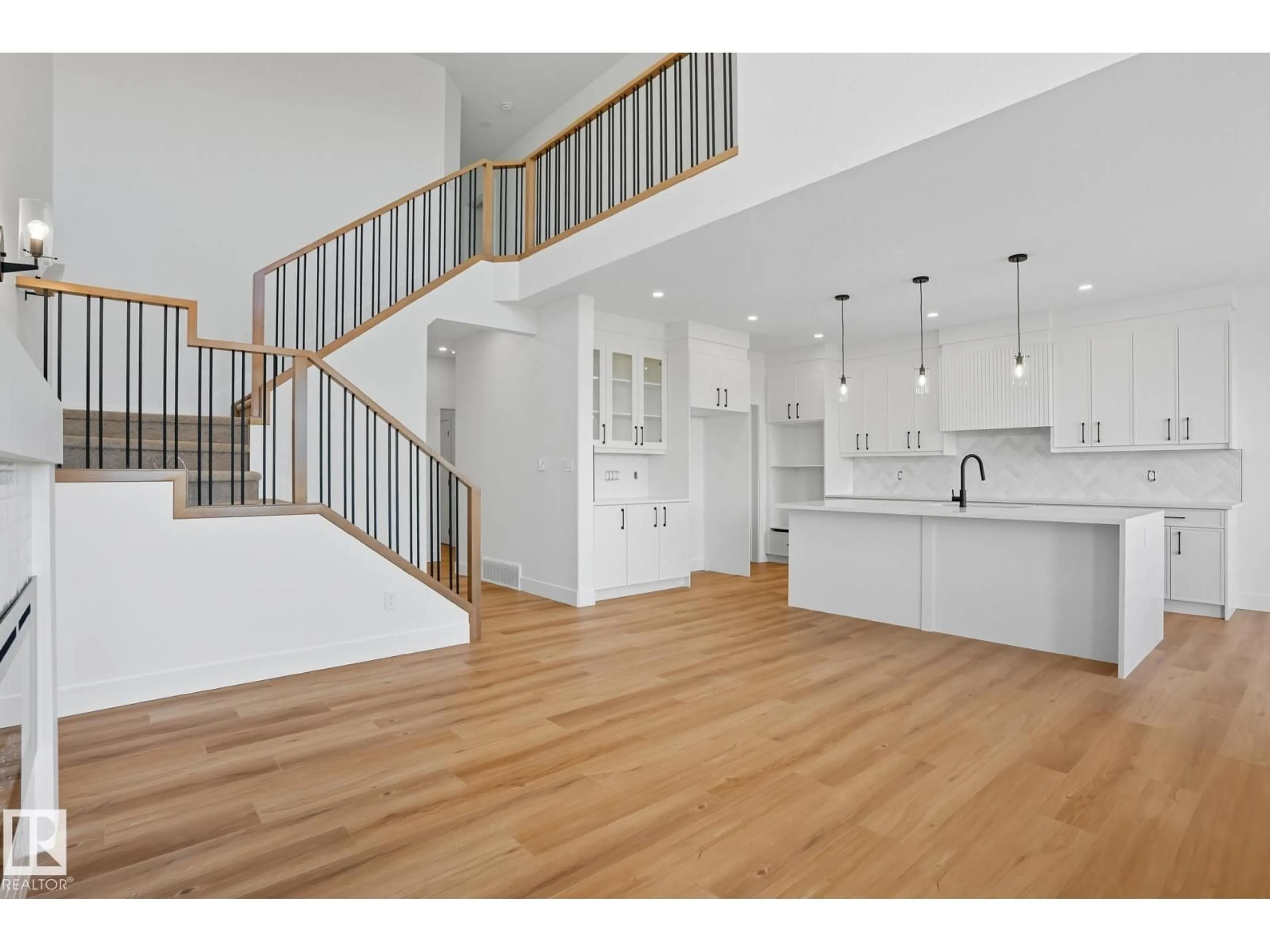 Open concept kitchen, wood/laminate floor for 8608 181 AV, Edmonton Alberta T5Z0X1