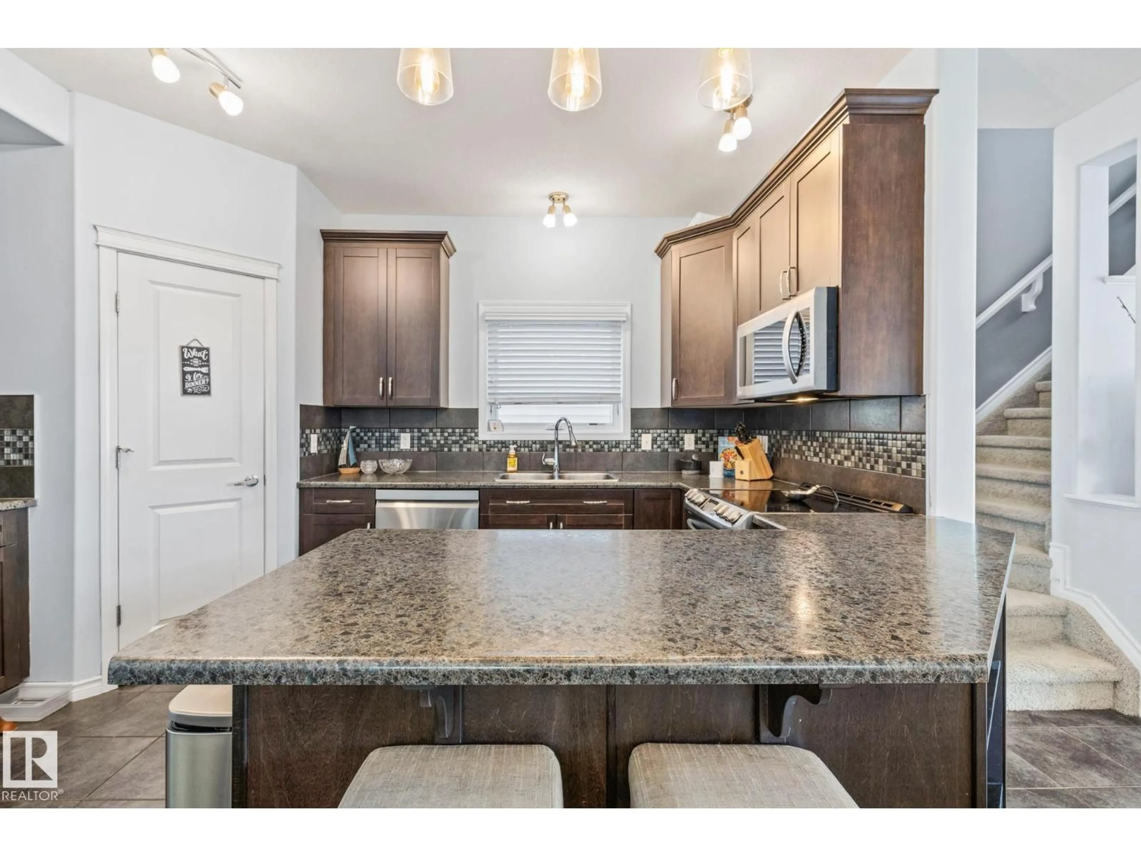 Open concept kitchen, ceramic/tile floor for SW - 7020 22 AV, Edmonton Alberta T6X0T8