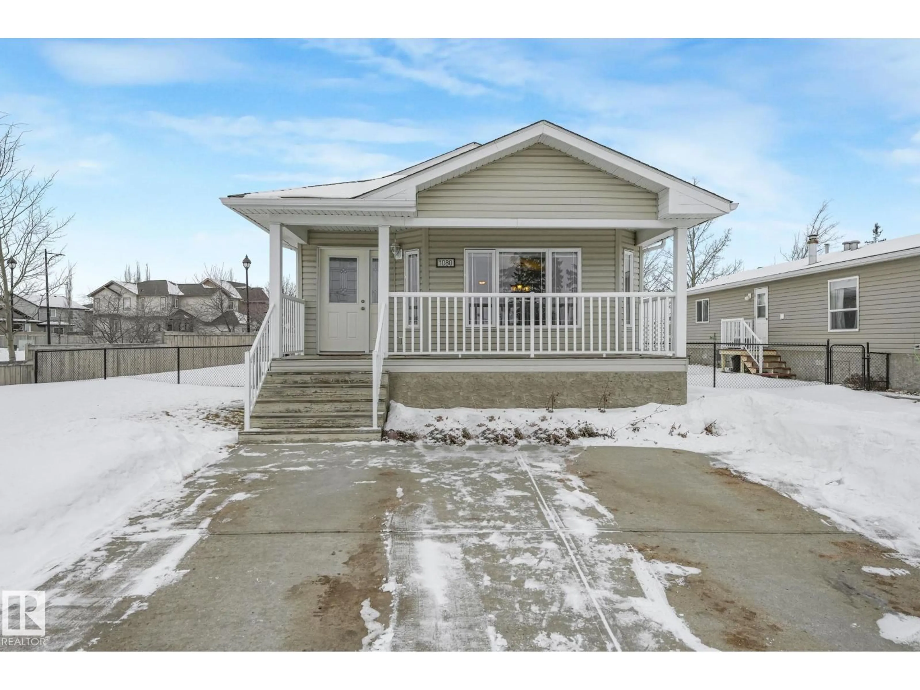 Home with vinyl exterior material, street for 1080 ASPEN DR, Leduc Alberta T9E8R1