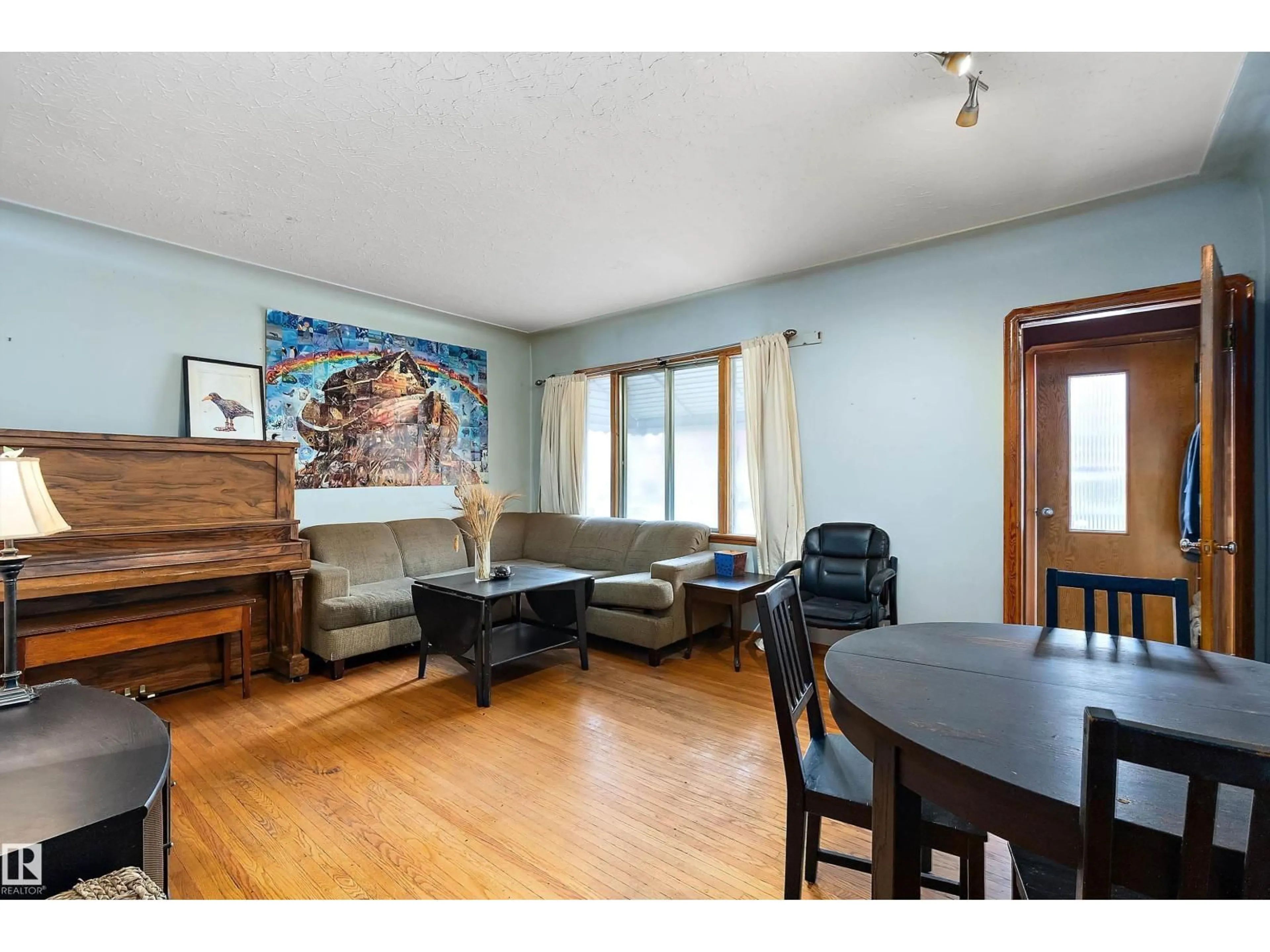 Living room with furniture, wood/laminate floor for 10124 88 AV, Edmonton Alberta T6E2R9