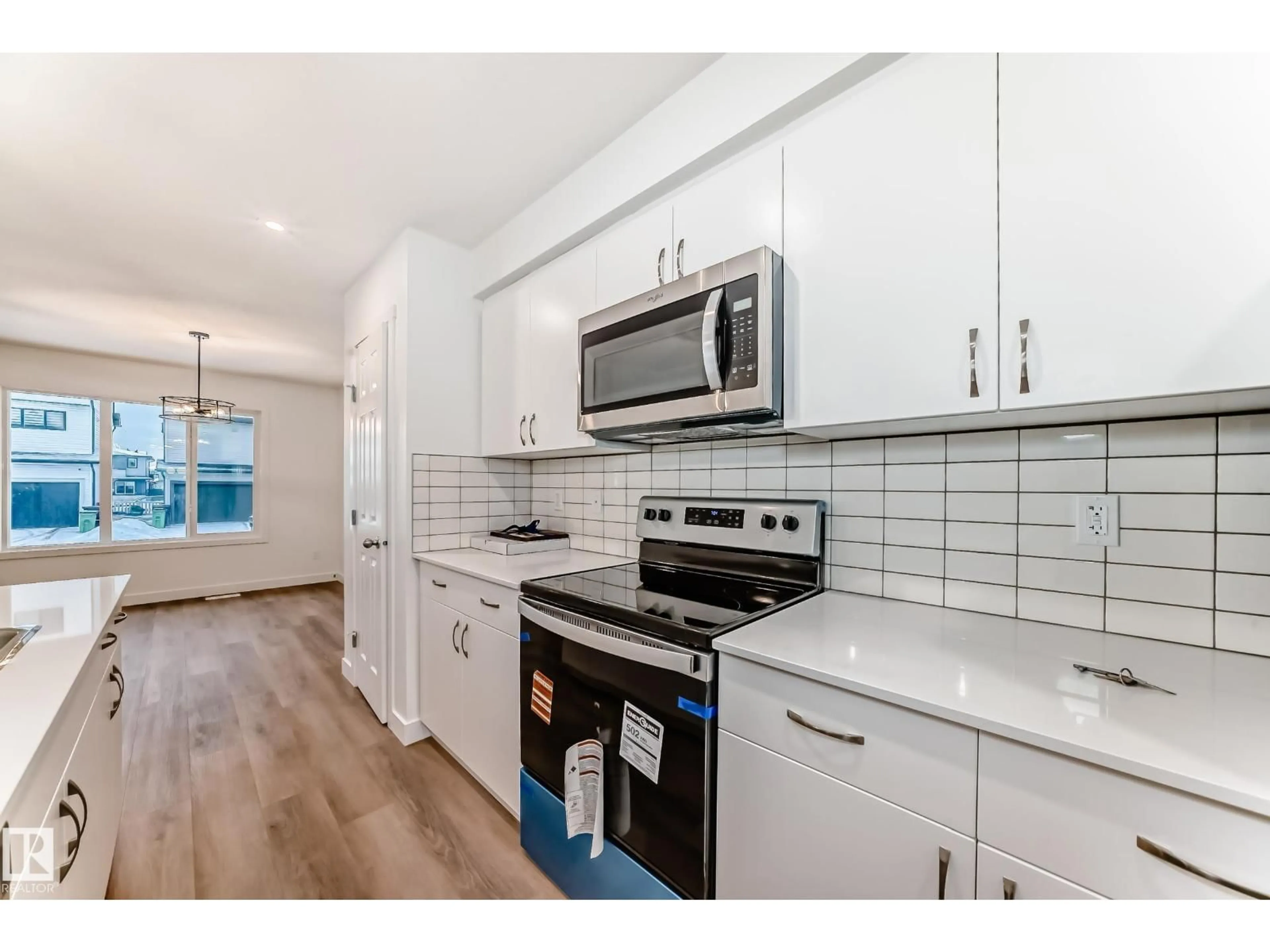 Open concept kitchen, ceramic/tile floor for 4619 177 AVE, Edmonton Alberta T5Y4B7