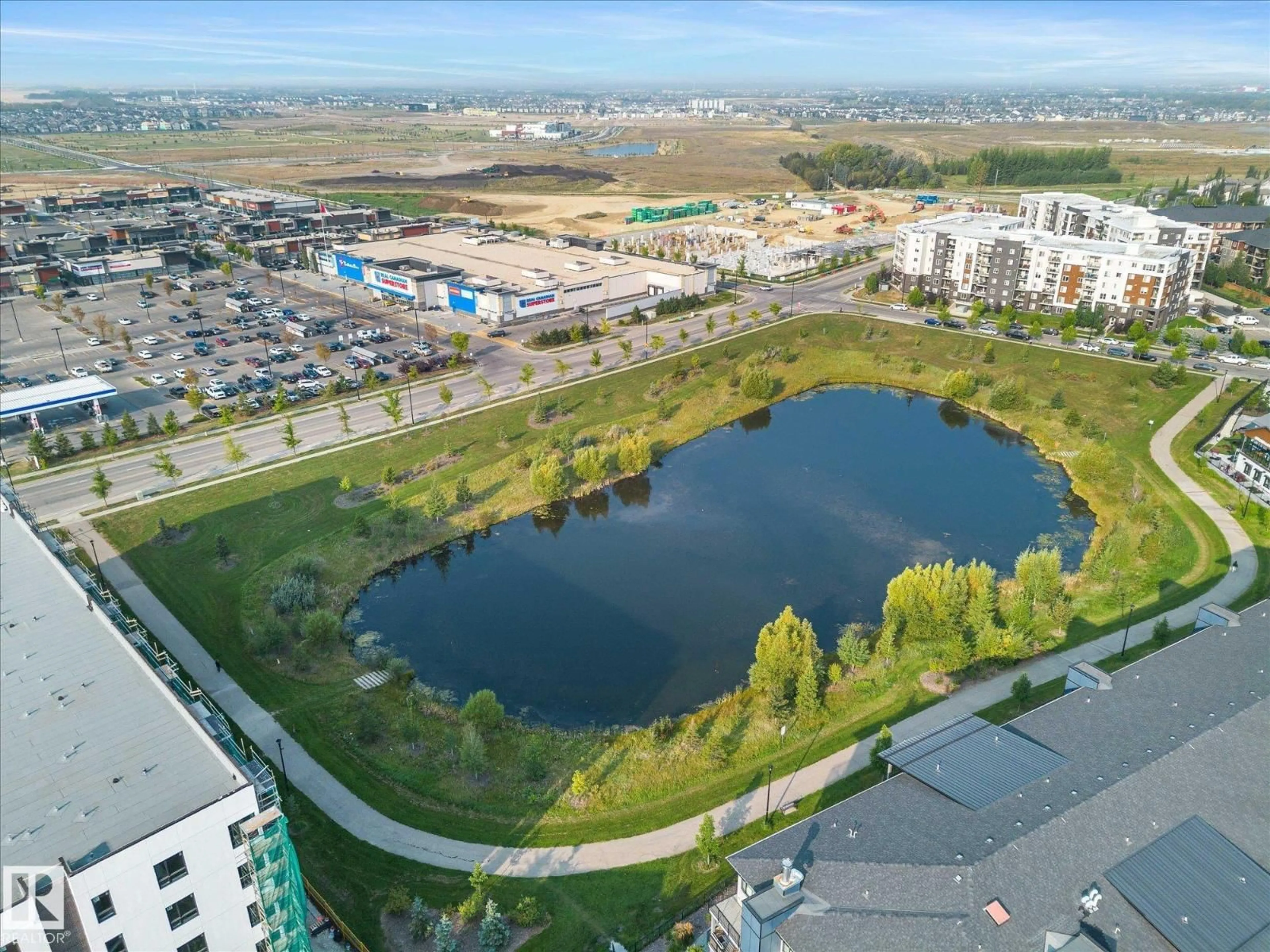 A pic from outside/outdoor area/front of a property/back of a property/a pic from drone, water/lake/river/ocean view for #402 - 11803 22 AV, Edmonton Alberta T6W2R9
