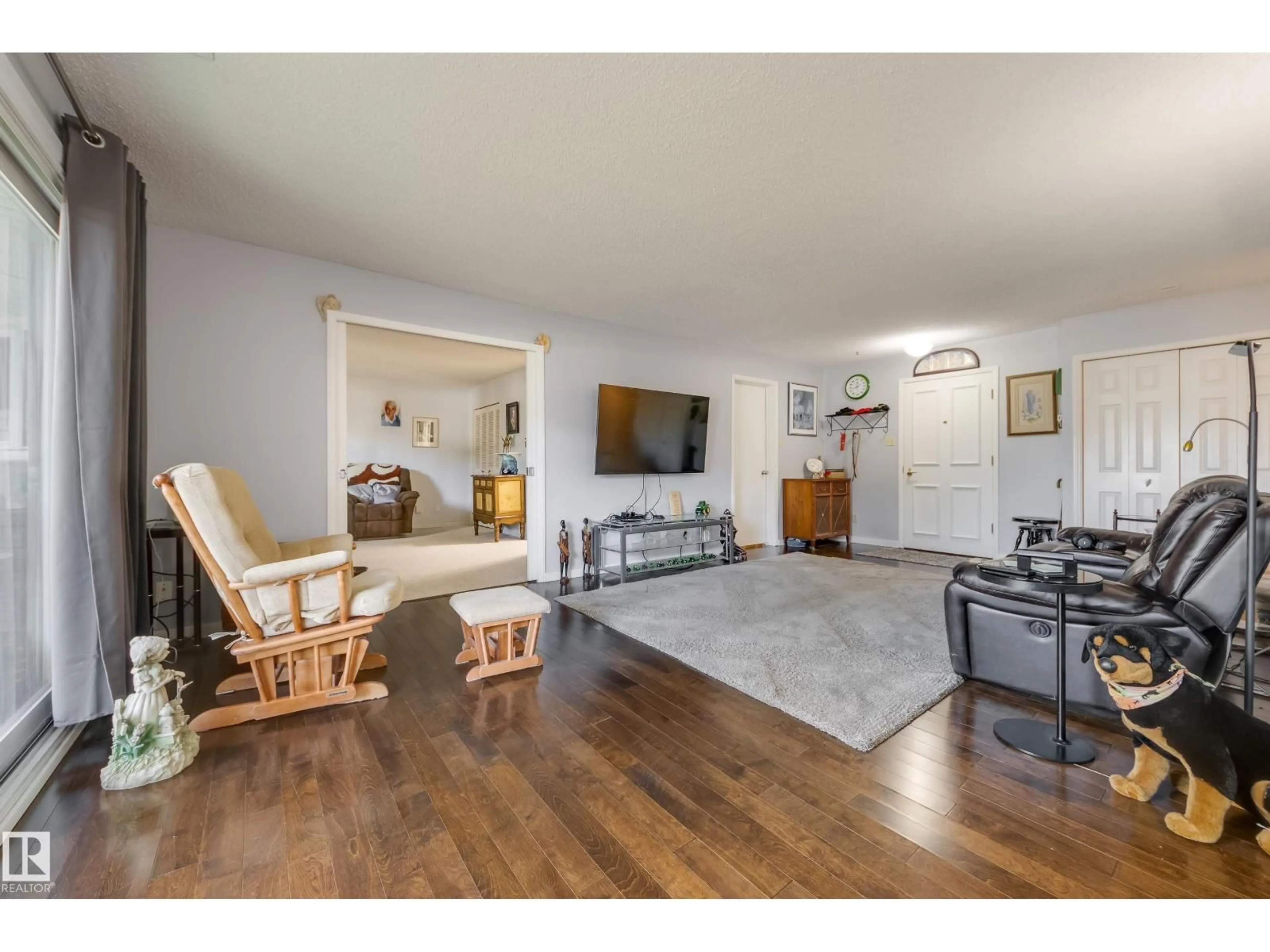 Living room with furniture, wood/laminate floor for #108 - 14810 51 AV, Edmonton Alberta T6H5G5