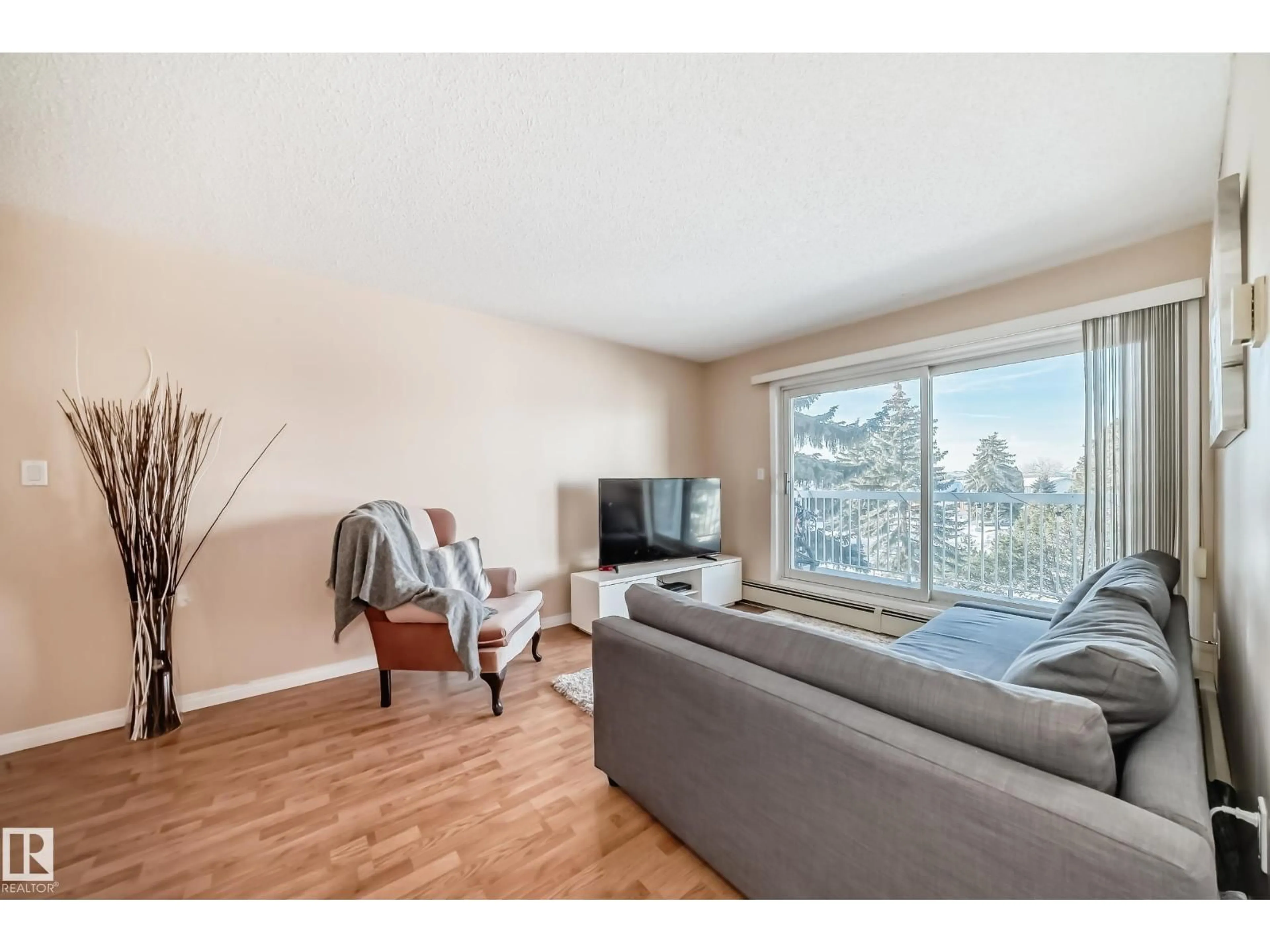 Living room with furniture, wood/laminate floor for #307 - 15503 106 ST NW, Edmonton Alberta T5X5W7
