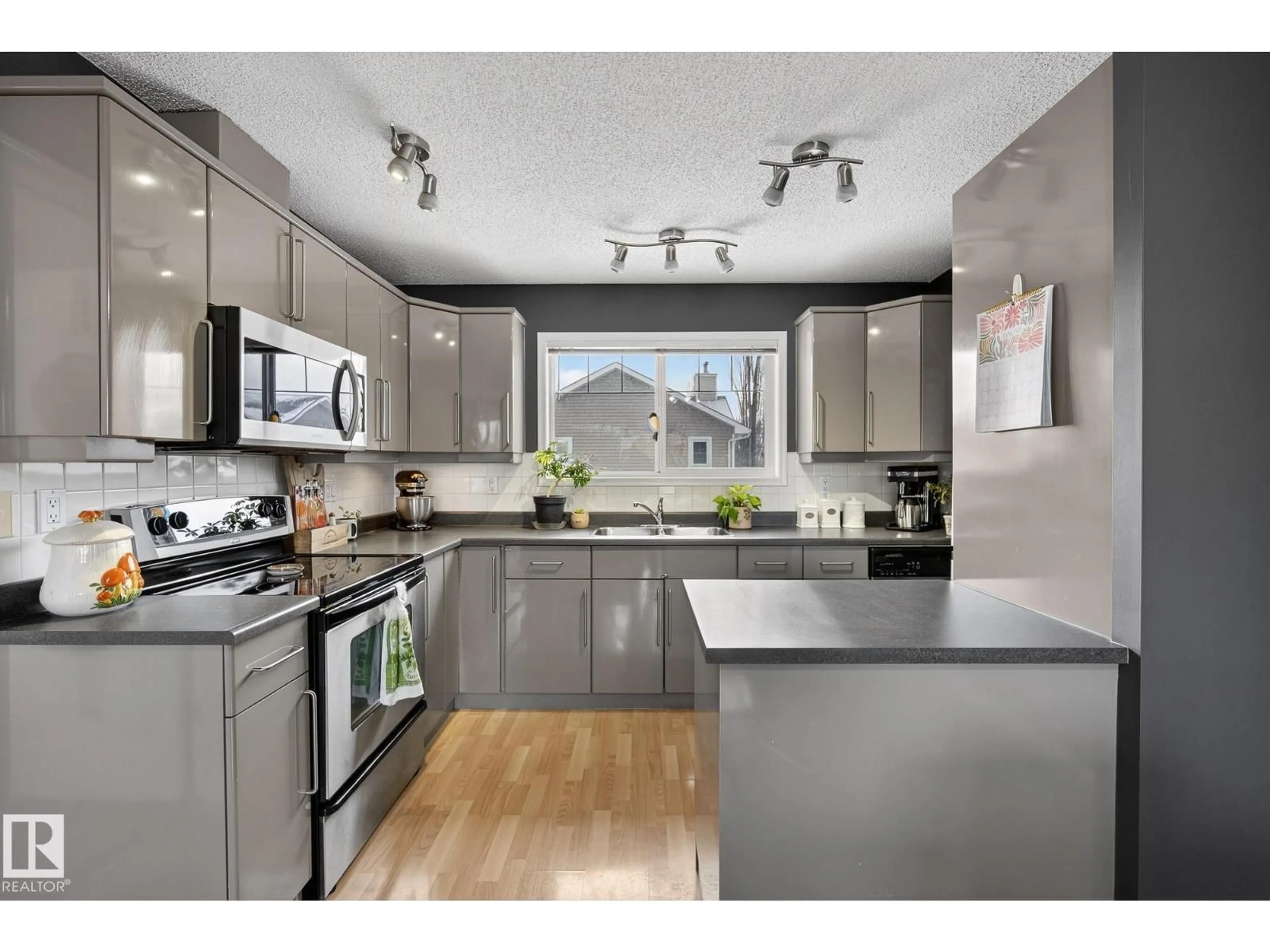 Open concept kitchen, wood/laminate floor for 70 - 13 CAVAN RD, Sherwood Park Alberta T8H2W9