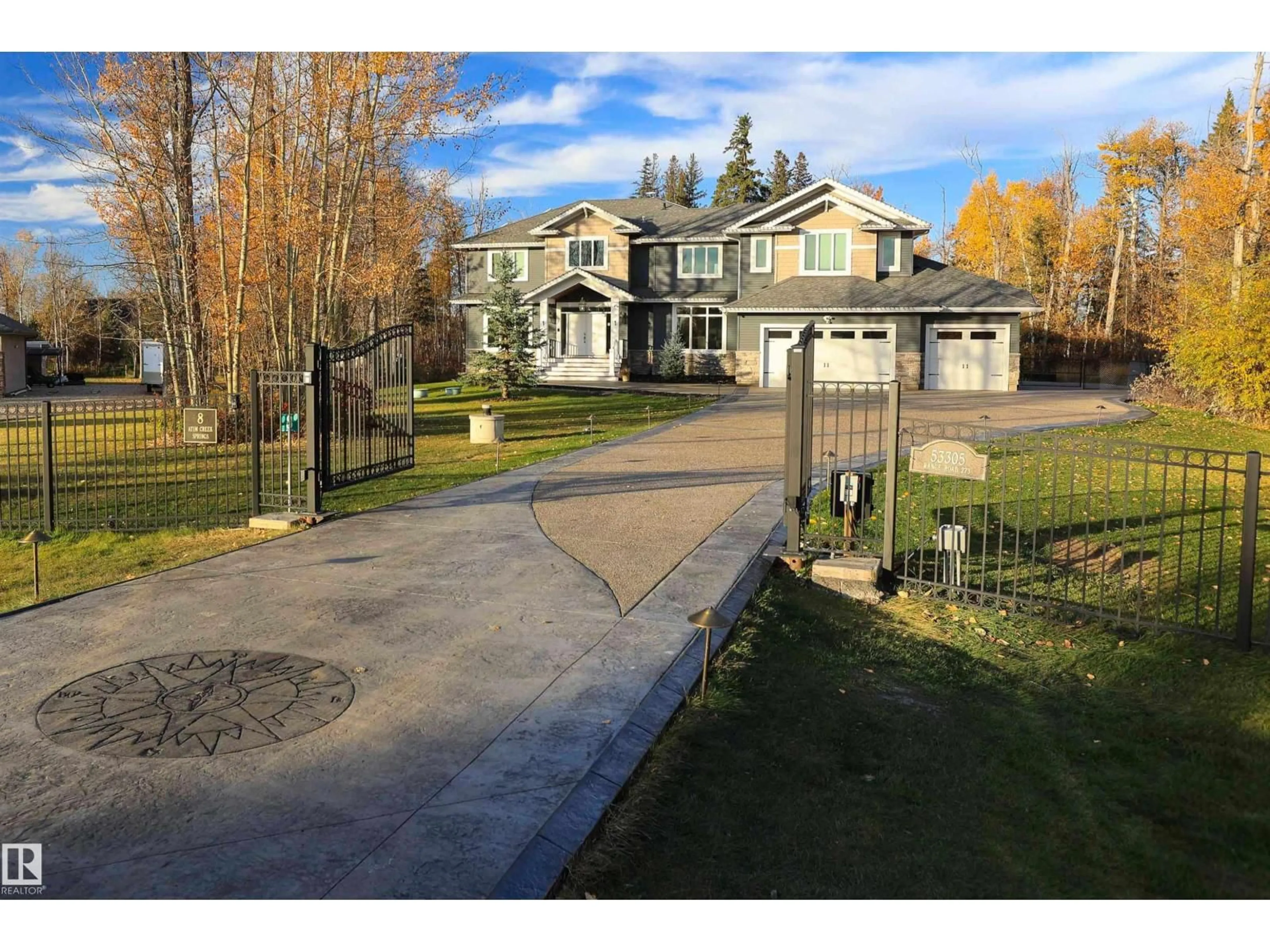 A pic from outside/outdoor area/front of a property/back of a property/a pic from drone, street for #8 - 53305 RGE ROAD 273, Rural Parkland County Alberta T7X3N3