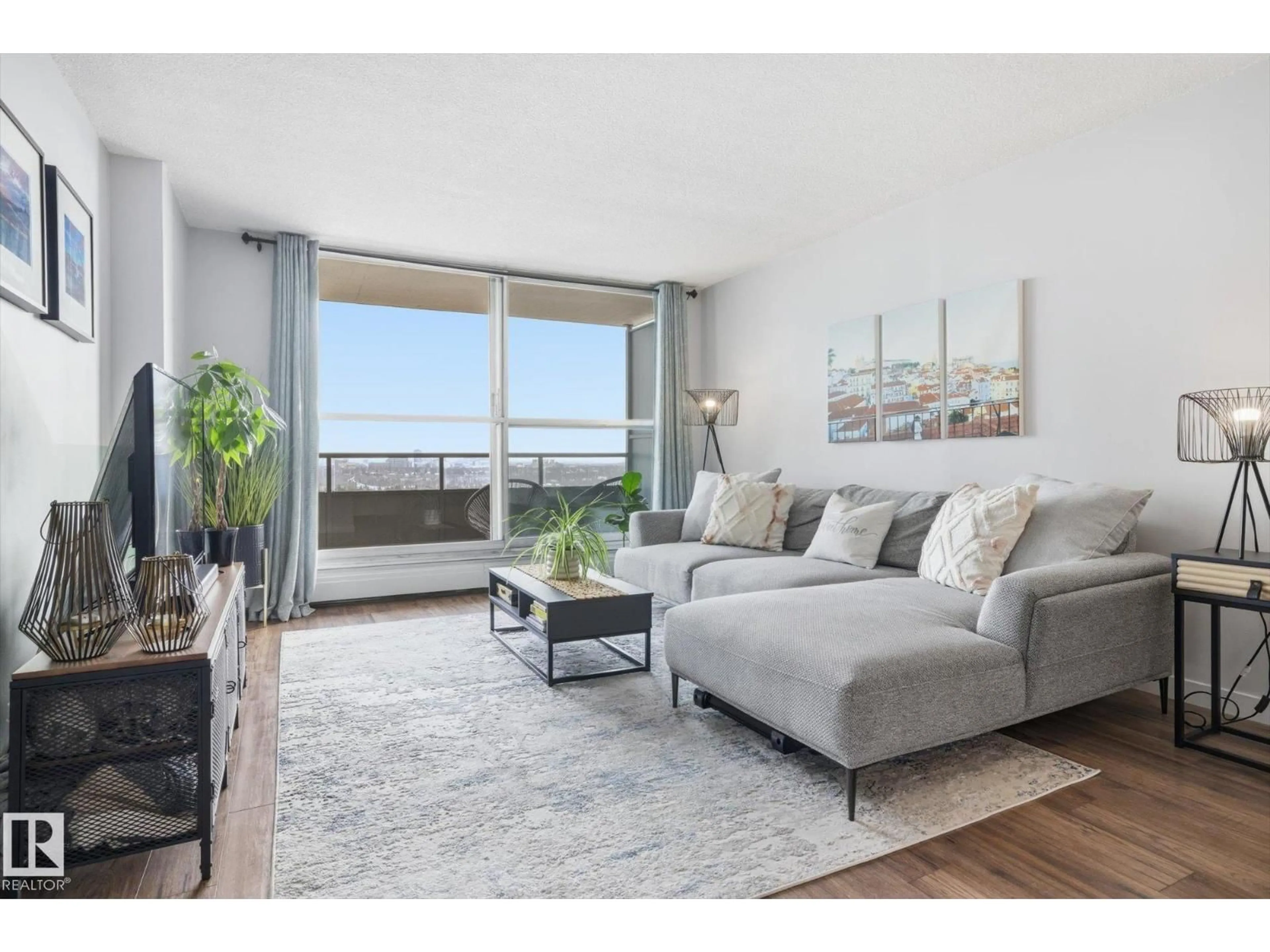 Living room with furniture, wood/laminate floor for 1513 STONY PLAIN RD, Edmonton Alberta T5N3R2