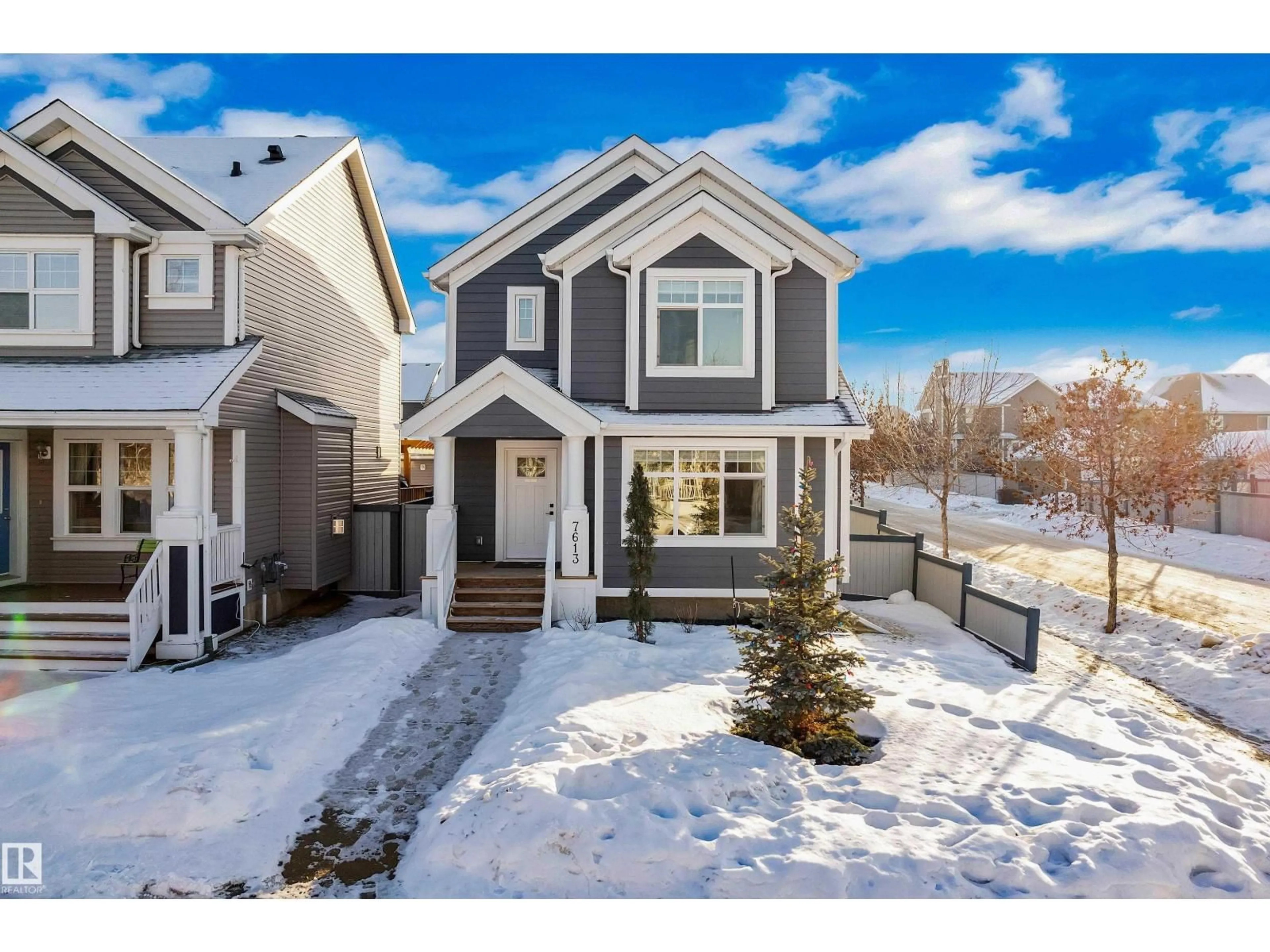 Home with vinyl exterior material, street for 7613 16 AVE SW, Edmonton Alberta T6X1M3